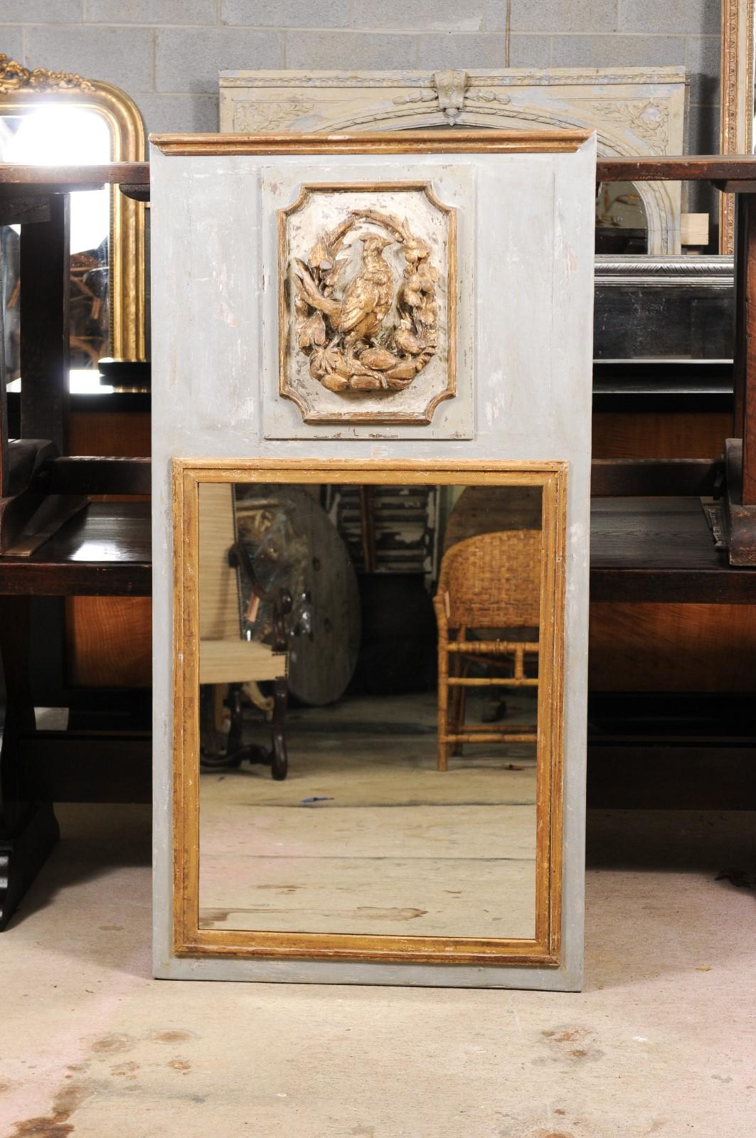 Two contemporary French grey painted trumeau mirrors made of old repurposed wood with hunting trophies and golden accents, priced and sold individually. We’re always on the hunt for pairs of trumeaux, and when they come with their own pretty hunting