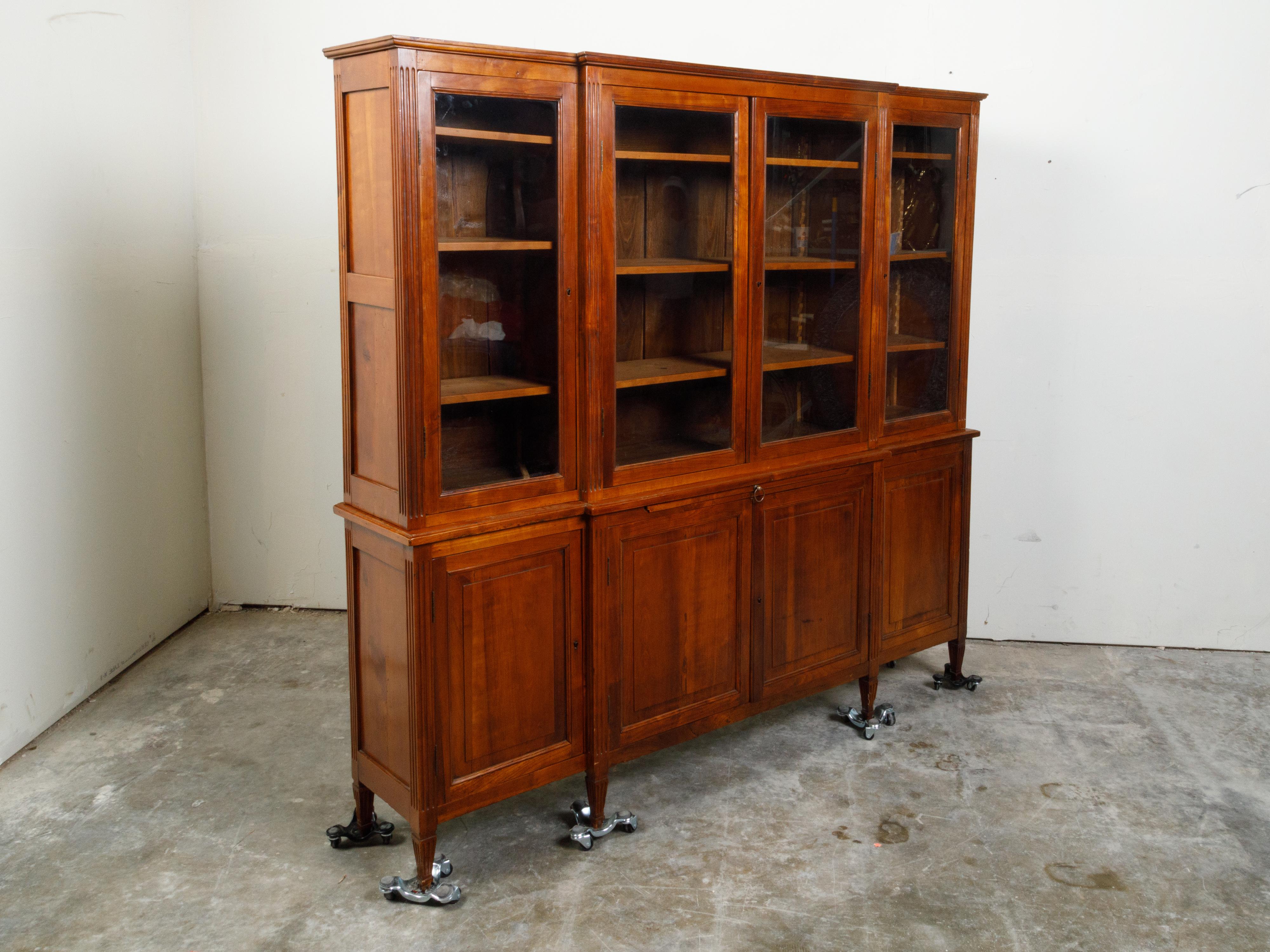 Carved French Restauration Period 1820s Walnut Breakfront Bookcase with Glass Doors For Sale