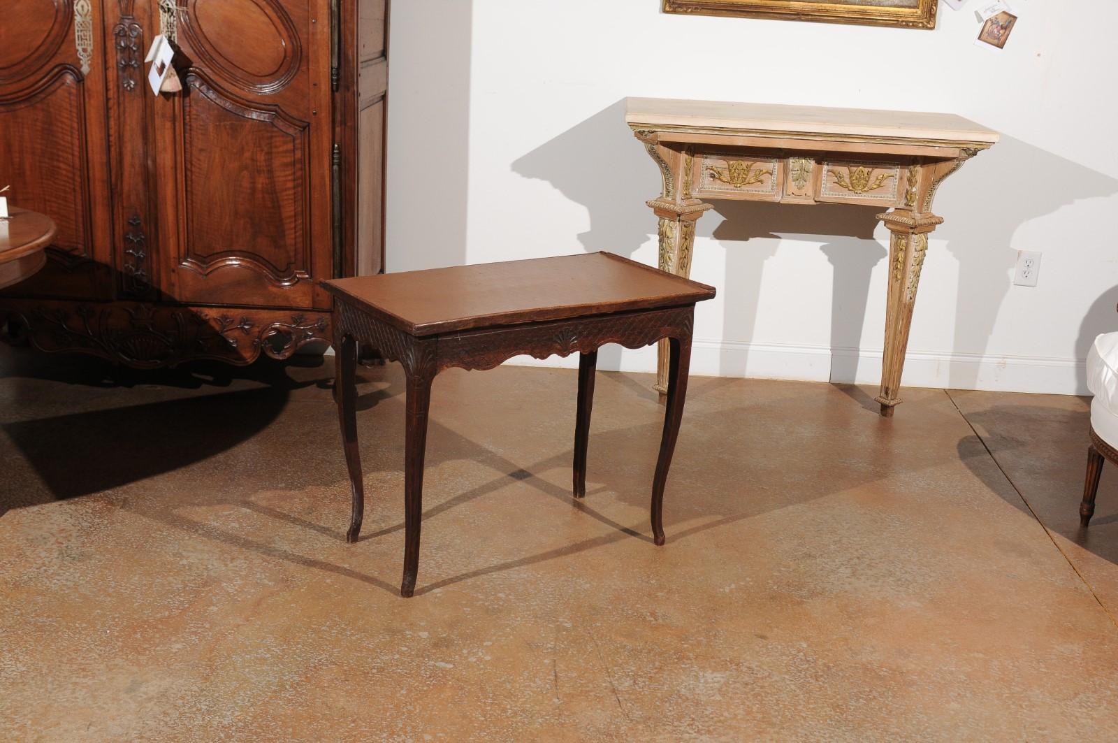 A French restauration period oak side table from the early 19th century, with tray top, two drawers and diamond motifs. Born in France during the restauration period that saw the brief return of monarchy, this charming side table features a