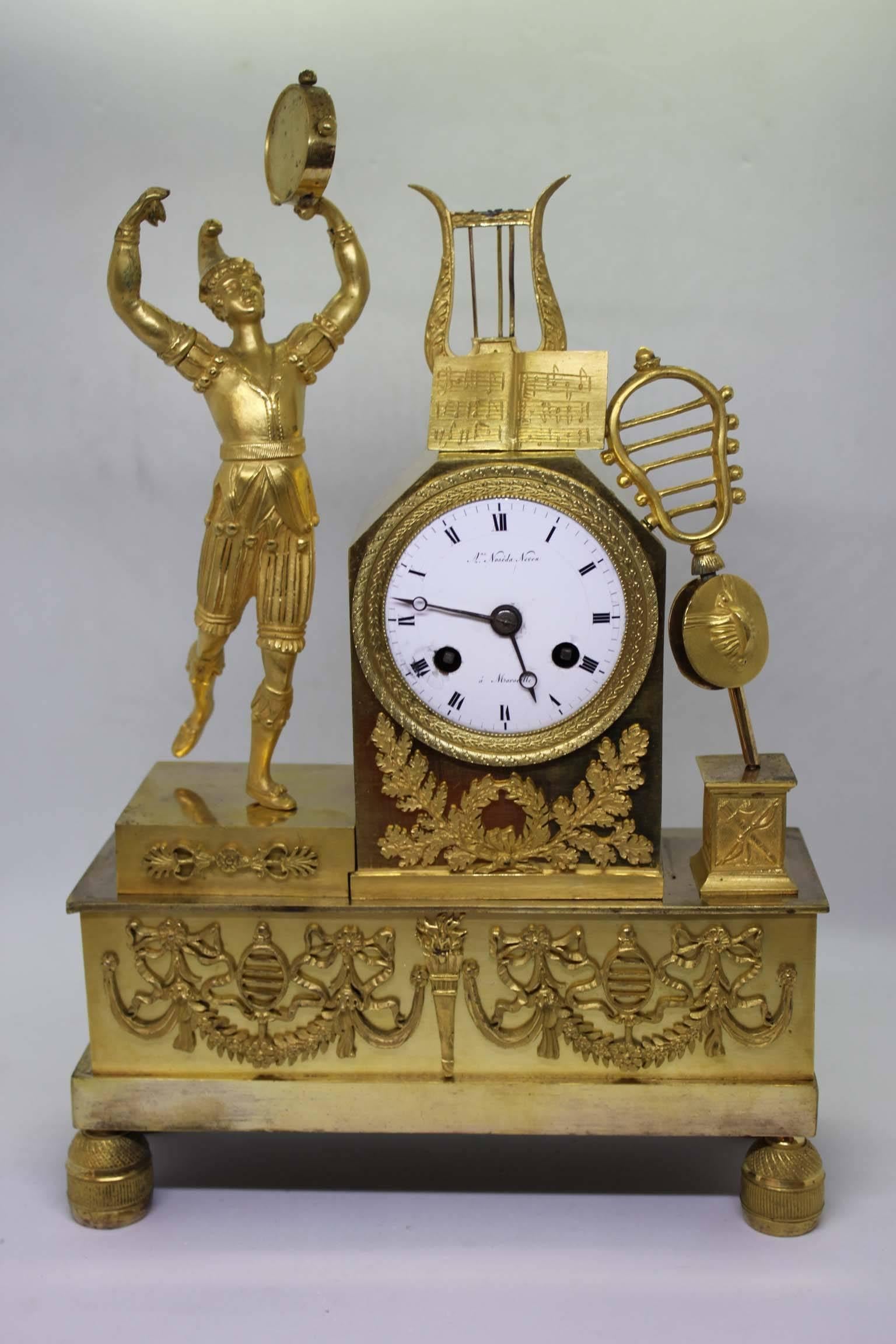 Gilt Bronze mantel clock representing allegory of music, from French Restauration period. 
Dial is signed 