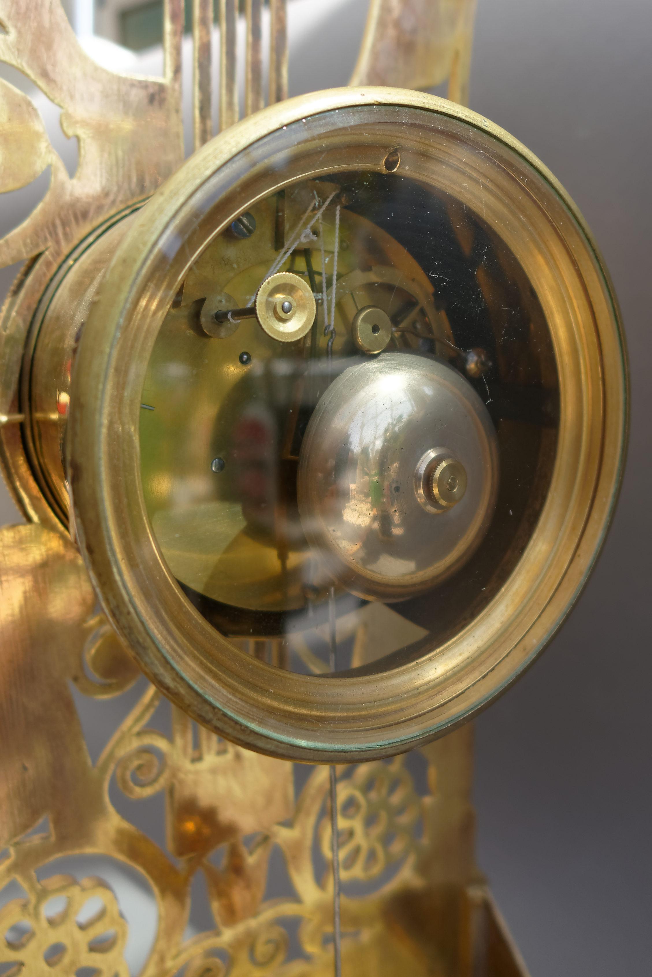 Bronze French Restauration Period Ormolu Lyre Mantel Clock with Apollo Mask For Sale