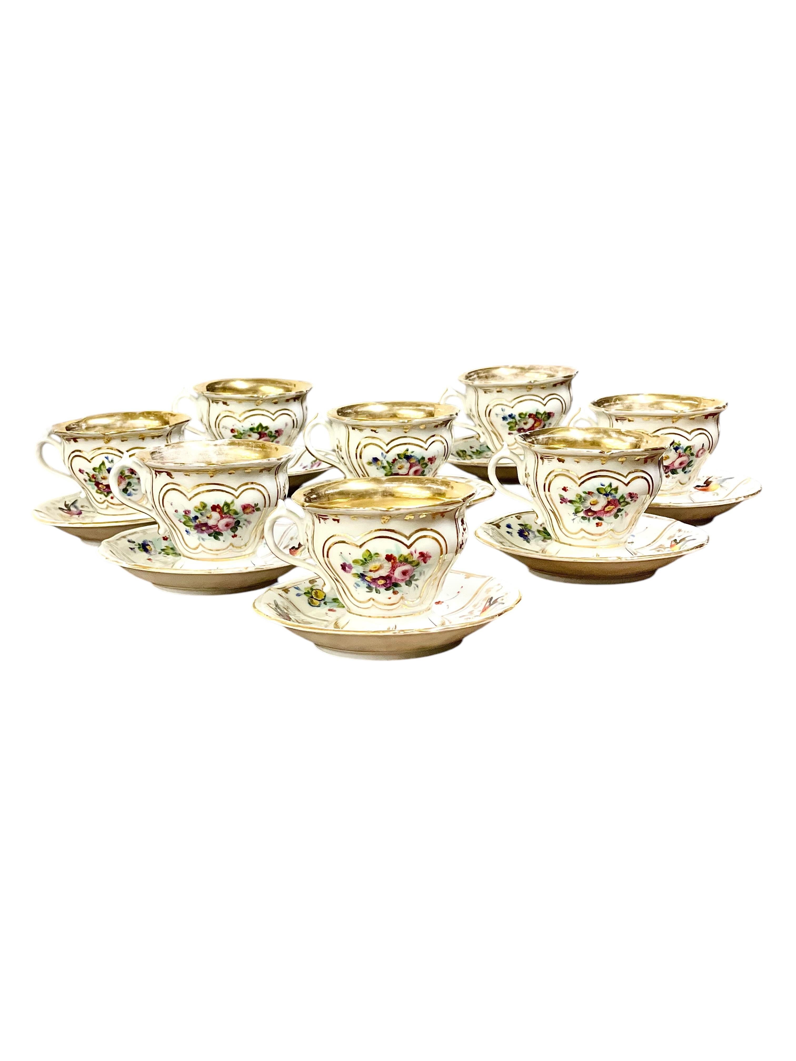 This refined 20-piece French porcelain tea set was crafted in Paris during the Restauration period (circa 1815–1830), a time known for its elegant and meticulously detailed porcelain. The set includes one teapot, one covered sugar bowl, two milk