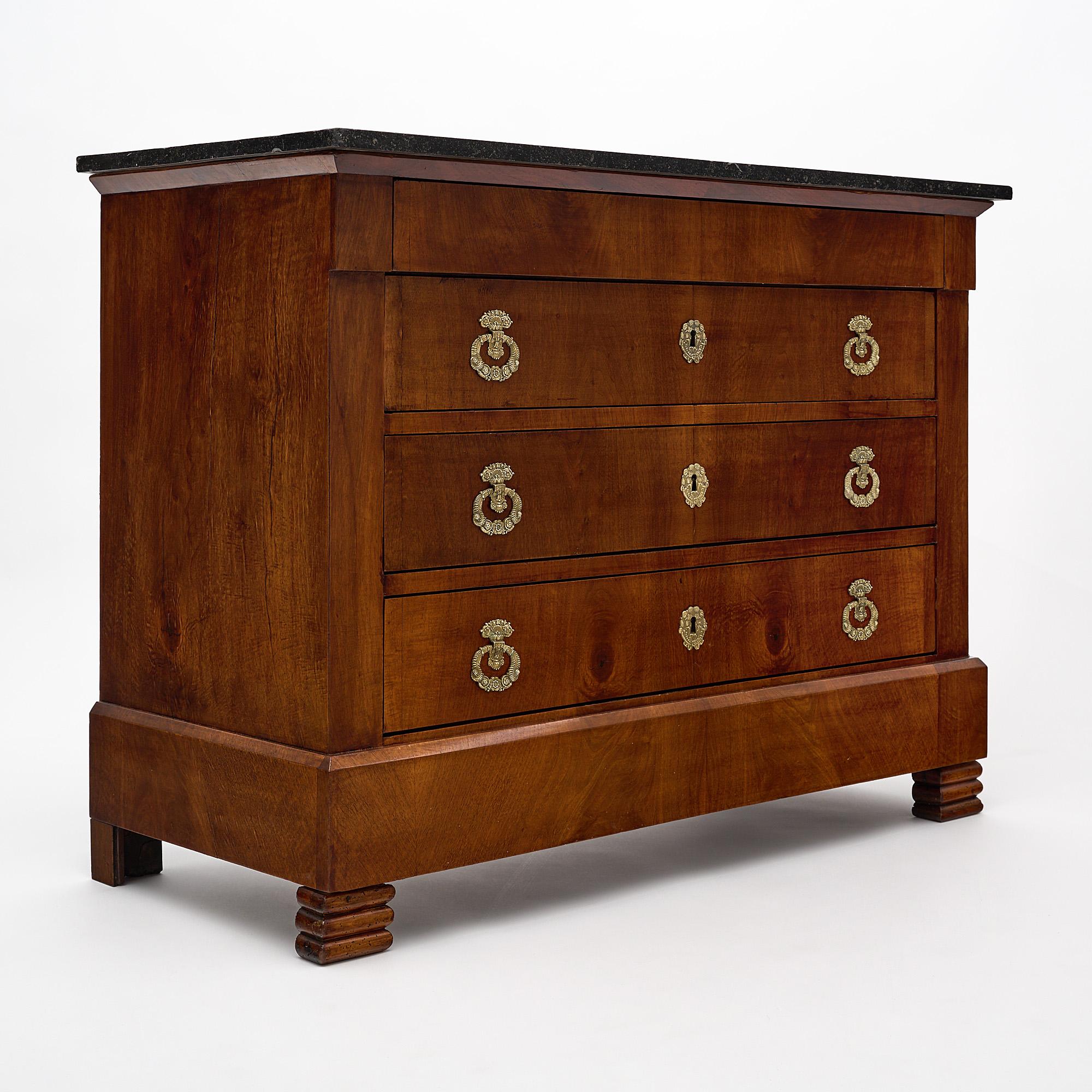 Chest, French, from the Restauration period, made of Mahogany. This chest has three dovetailed drawers in façade and one dovetailed drawer concealed in the apron. On top there is a beautiful intact black marble slab.