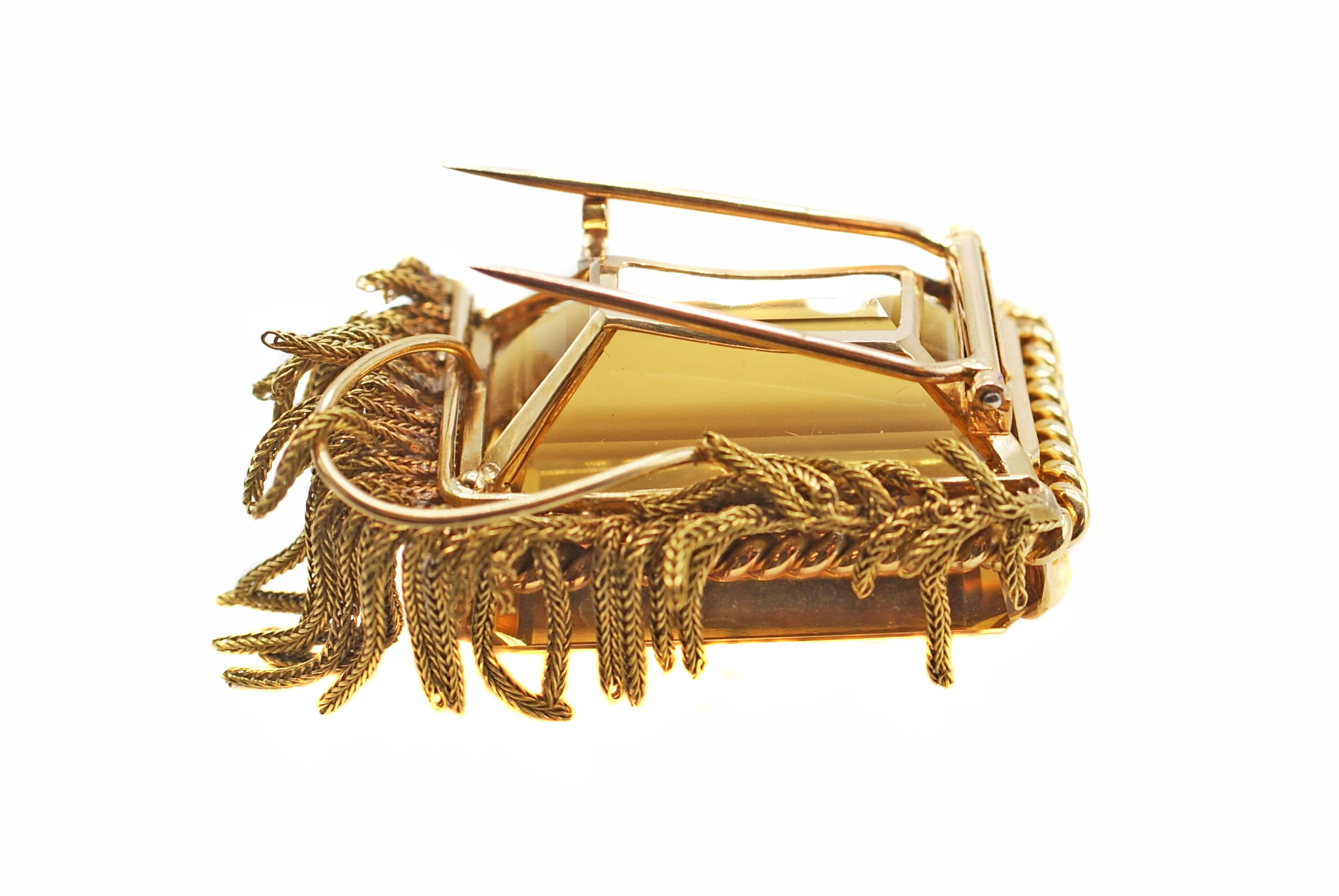 This unique French Retro Brooch from ca. 1940 is centrally set with one emerald cut golden Citrine measured to weigh over 90 carats. The beautifully saturated golden color and perfect cut give this gemstone an amazing life and brilliance. This