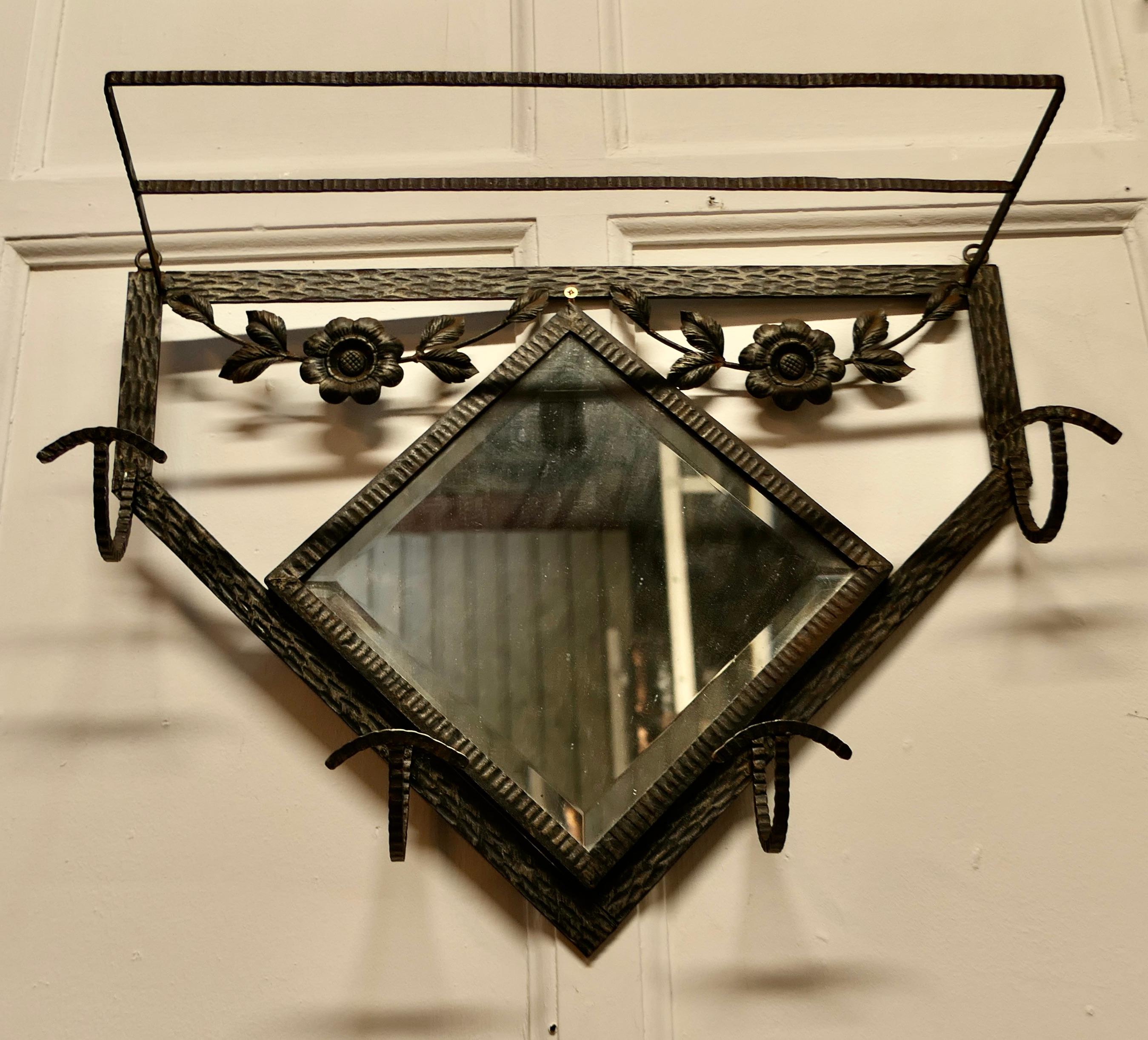 French Retro Chic Iron and Toleware Hat and Coat Rack with Mirror


 This delightful French 60s coat rack has a Diamond shaped bevelled mirror and it is decorated with toleware flowers, it has 4 curved iron hooks and a luggage shelf over the top
A