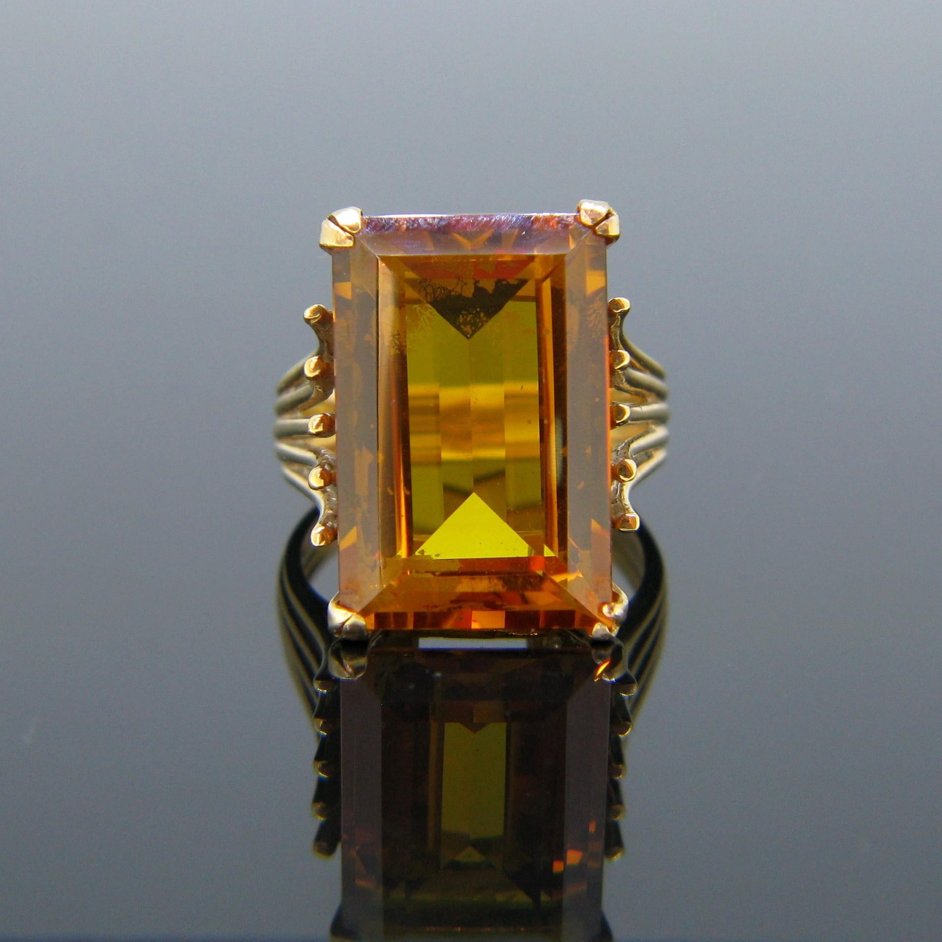 This French ring was made circa 1950 during the Retro years. It is fully made in 18kt yellow gold as it is marked with the eagle’s head.  It is set in the centre with a rectangular cut citrine with a vibrant autumn orange colour weighing around