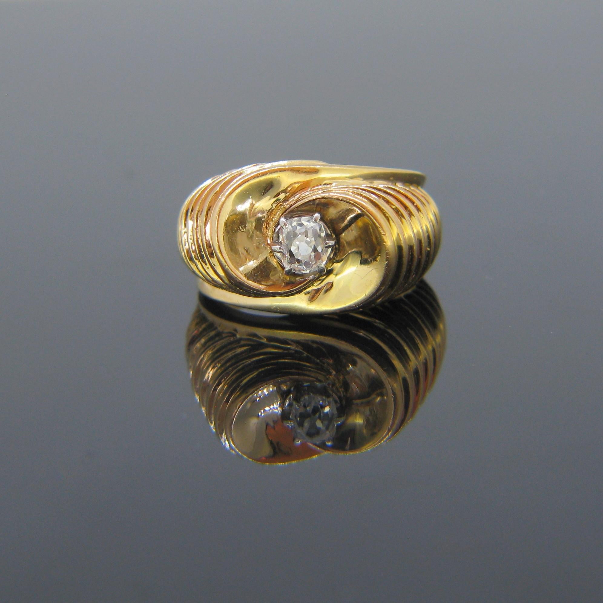 Weight:	10.88gr

Metal:		18kt Yellow Gold (tested) 
	Platinum

Stones:	1 Diamond
•	Cut:	Old Mine
•	Carat Weight:	0.40ct approx.
•	Color:	I
•	Clarity:	VS

Condition:	Very Good

Comments: 	This beautiful ring was made circa 1950. It is fully made in