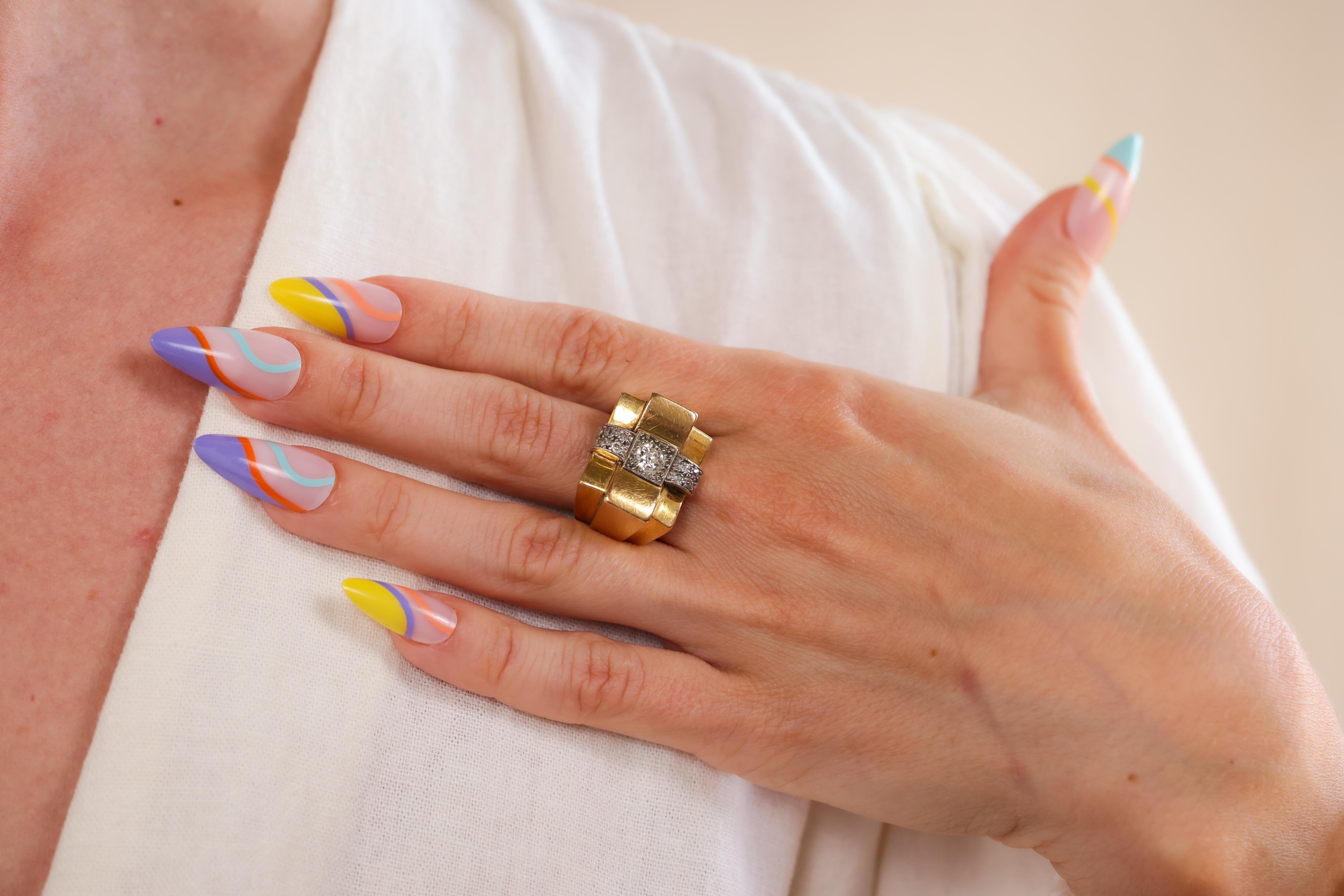 Center Stone: Diamond
Cut: Old European
Weight: Approximately 0.40 Carats
Color: J-K
Clarity: VS2
Accent Stone: 8 Diamonds
Cut: Old European 
Weight: Approximately 0.25 Carats
Color: J-K 
Clarity: SI
Metal: 18k Yellow Gold & Platinum 
Era: Retro