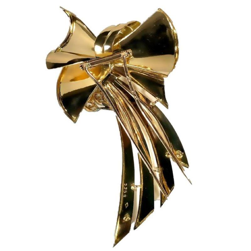 This very large and striking French Retro period bow brooch with flowing tails, is set at it's cinch with Old European cut diamonds that have a total approximate weight of 2.65ct of overall quality of H Color and VS-SI
clarity. Measuring 3 5/8