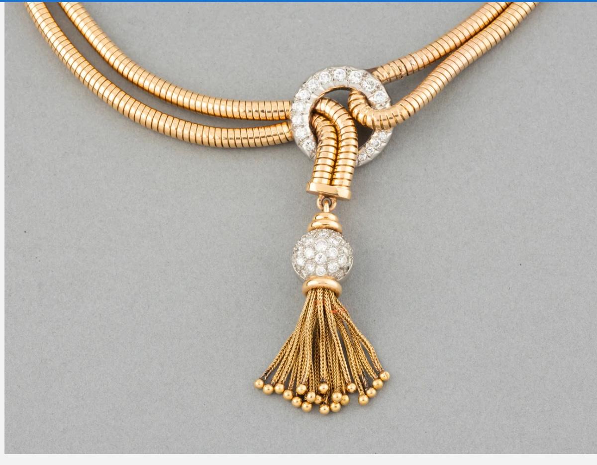This is a striking 18k French Retro Diamond Tassel Statement Necklace that will add a touch of elegance to anything it is worn with! The necklace measures 16” with a 3” drop and can be worn off center for high drama!