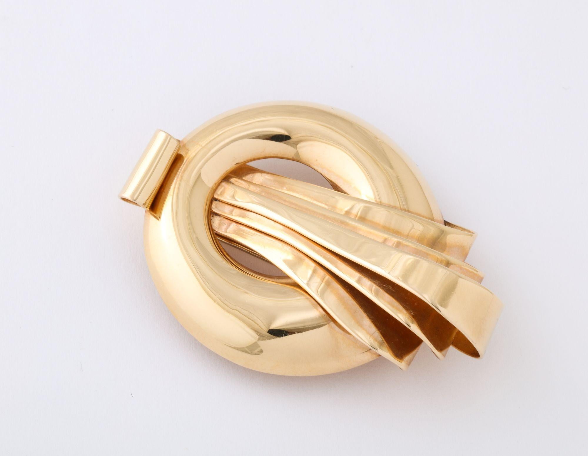 A classic French Retro Clip/ Brooch in the style of Mauboussian. Measuring approx. 2 1/4