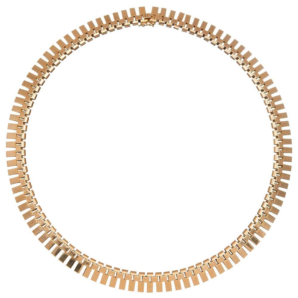 A fringed necklace of 18 karat rose gold, each link articulated to allow it to drape effortlessly around the neck. Attractive and sophisticated, the absence of gemstones makes this piece suitable for both day and evening events. The sculpted, modern