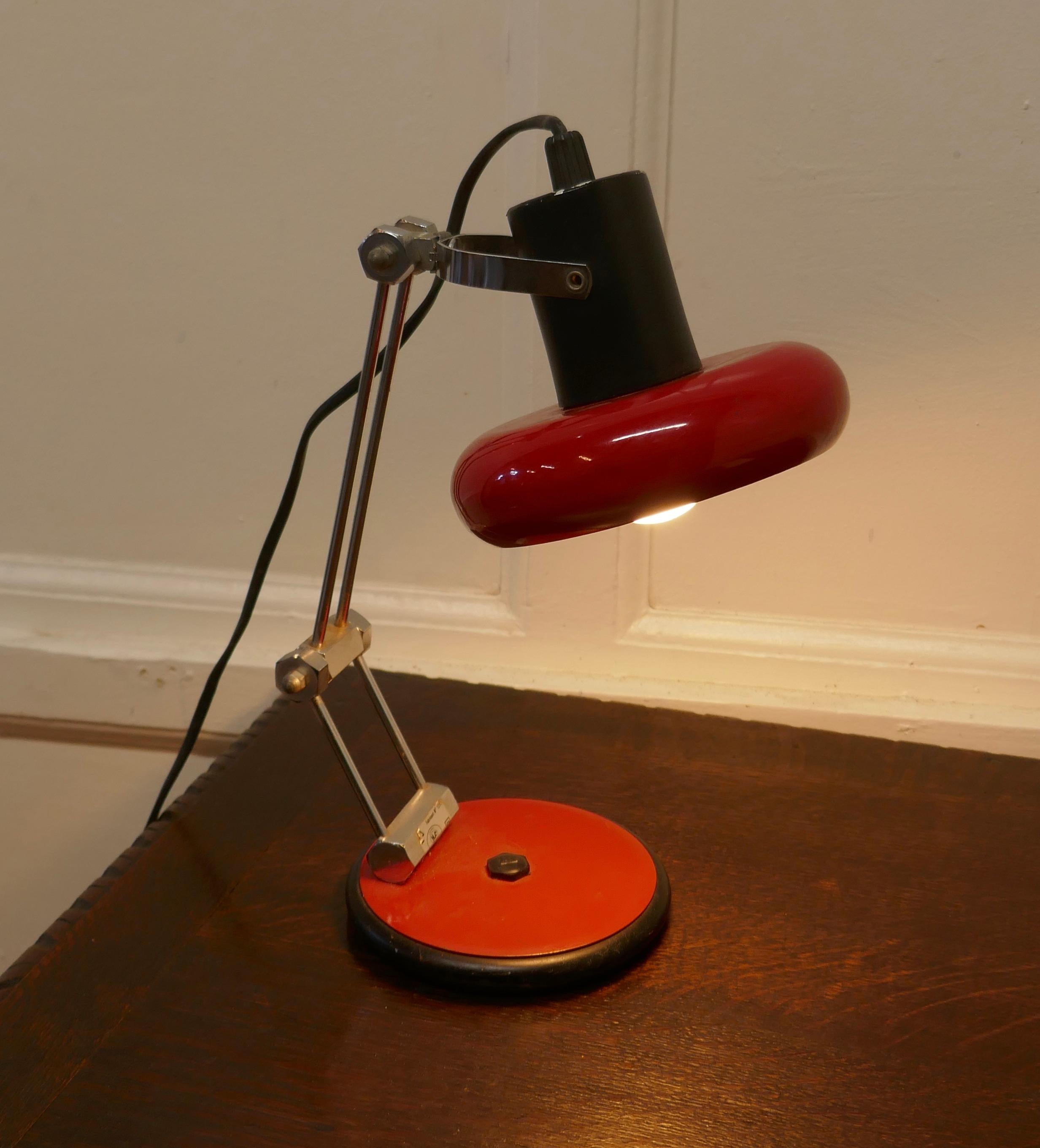 French Retro Sputnik angle table lamp

Very stylish statement piece in red, with a round shade which can be angled a little to suit 
Measures: The lamp is 13” tall, and 9” in diameter
WD52.