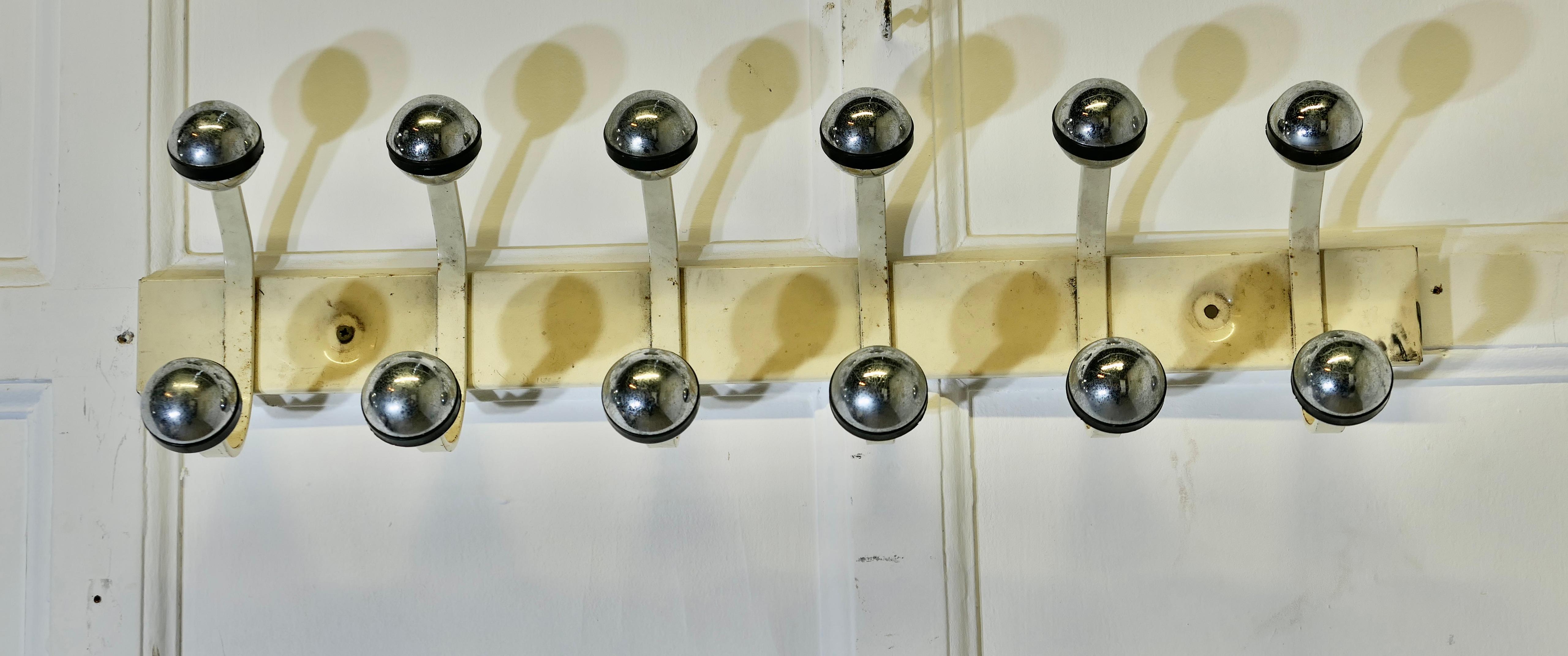 French Retro Style “Sputnik” Chrome Coat Rack, Hat and Coat Hooks

Long chunky set, 6 double “Sputnik” coat hooks, wall coat rack
The rail is 27” long, 8” high and stands 6” out from the wall
ZX290