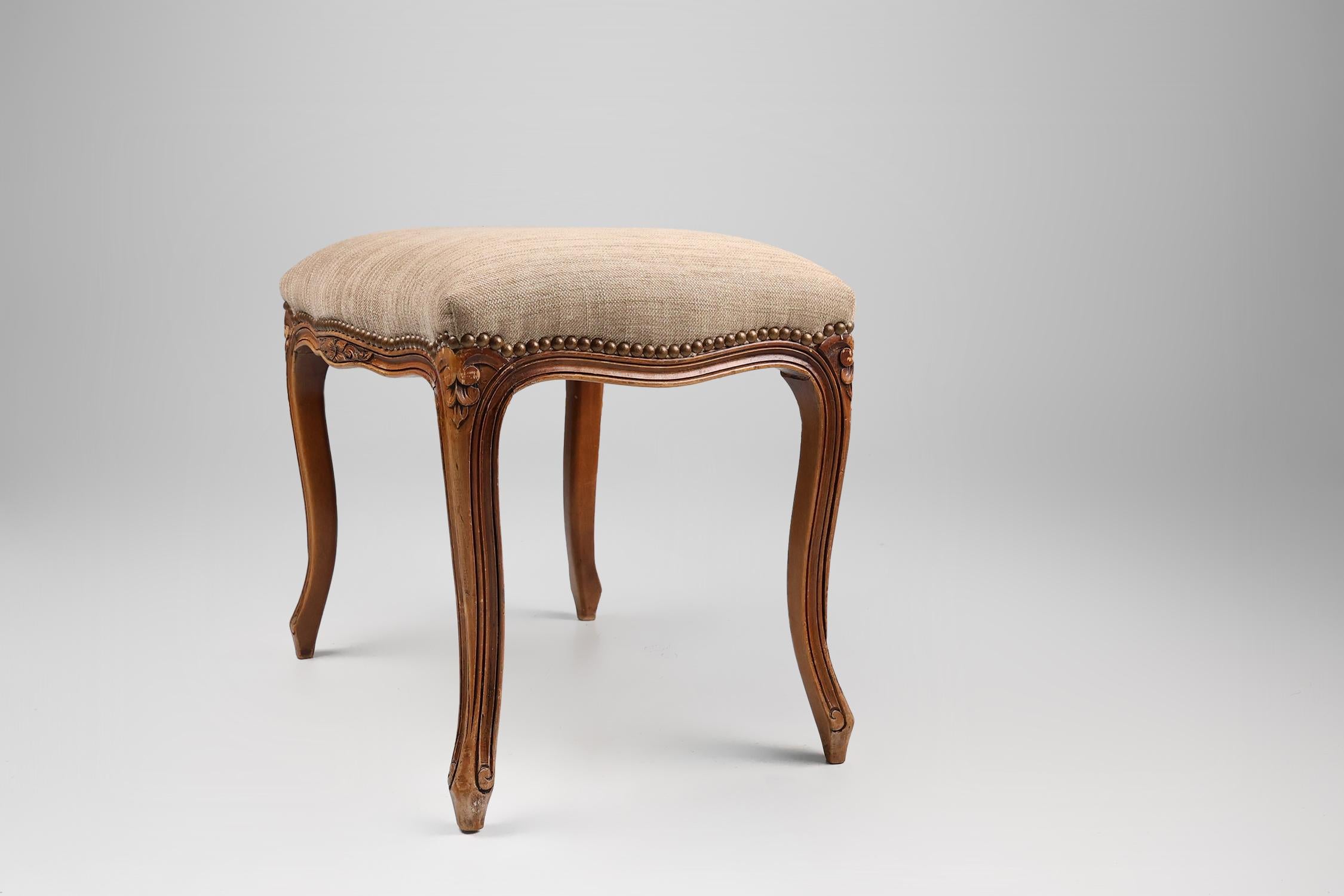Mid-20th Century French reupholstered Louis XV style footstool in carved wood