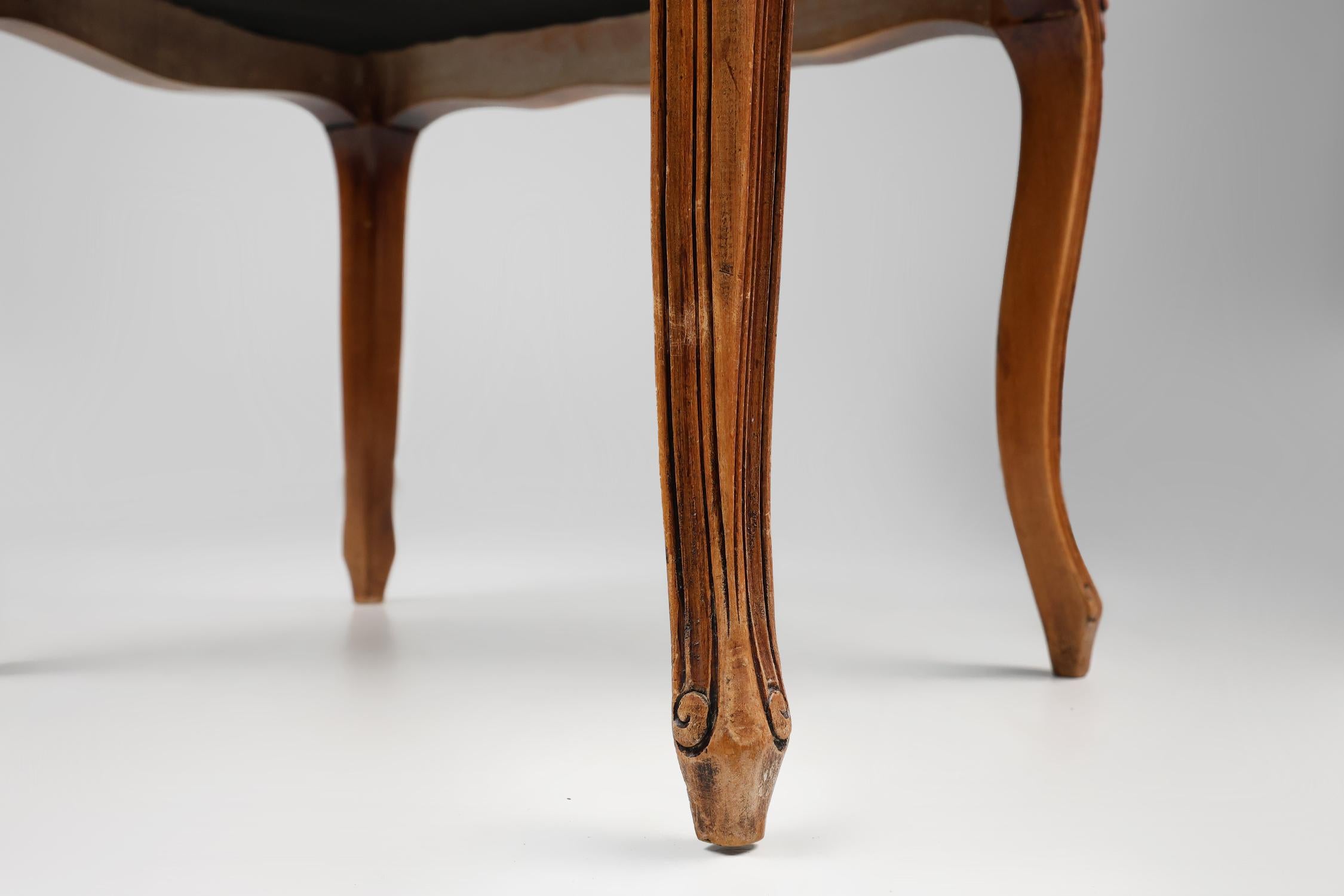 Fabric French reupholstered Louis XV style footstool in carved wood