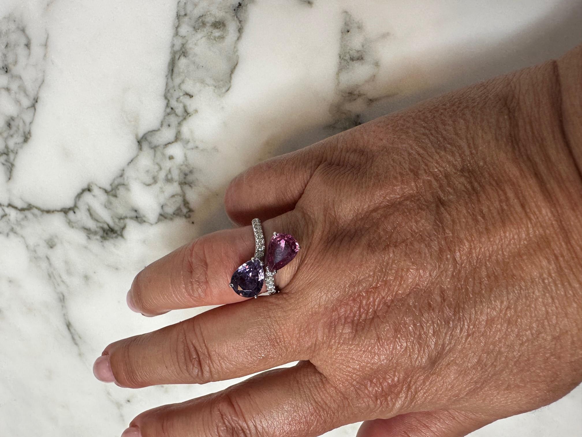 French Ring Two Sapphire Corundum Violet Pink Diamonds White Gold 18 Karat 

Discover this beautiful French fashion ring in 18 karat white gold, set with 16 sparkling pave diamonds (0.260 ct) F. This open ring offers an elegant and contemporary