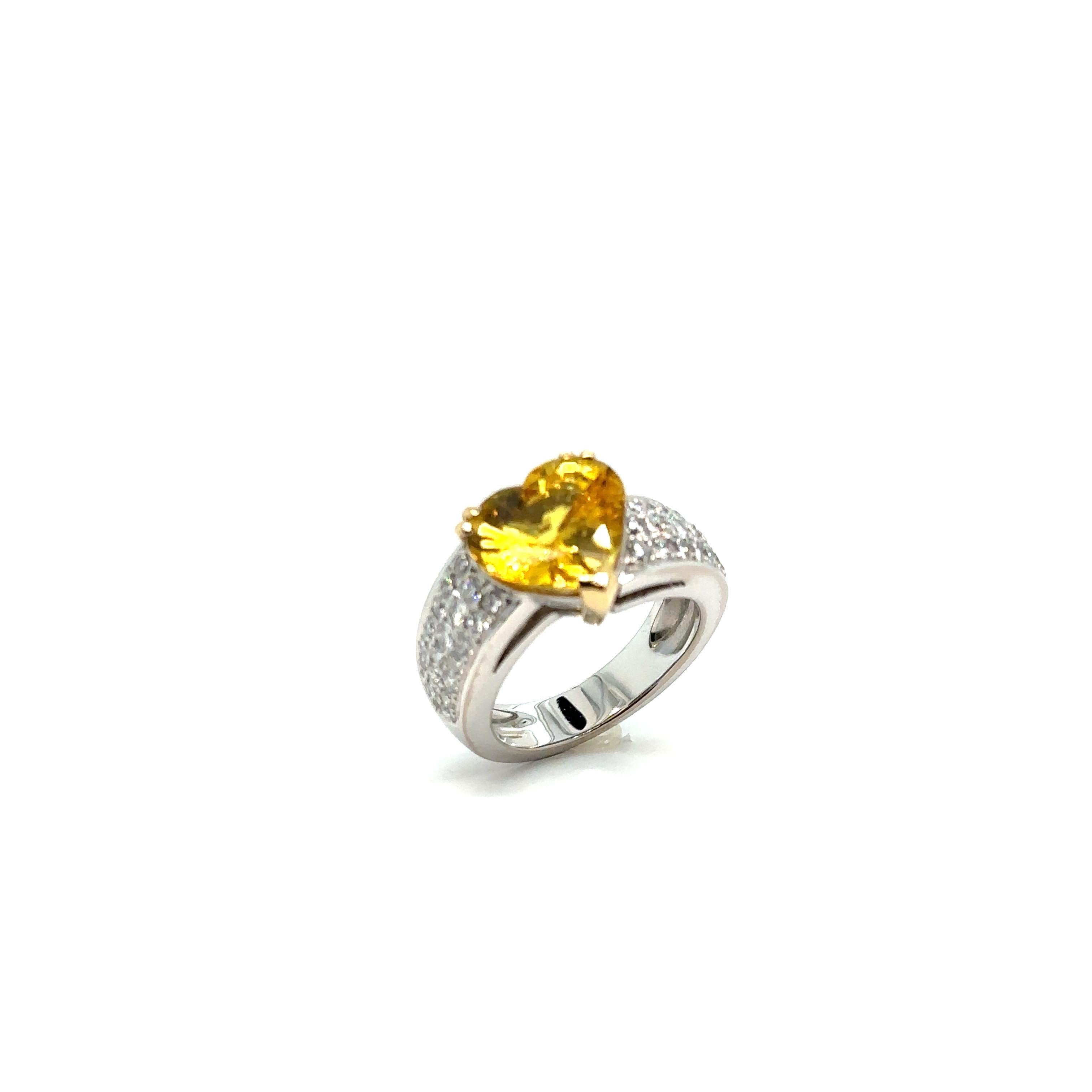 French Ring, Yellow Sapphire Heart, Pavage Diamonds

Ring in 18 karat white gold 750/1000, 11.71 grams, composed of a 5.11 carats yellow sapphire 