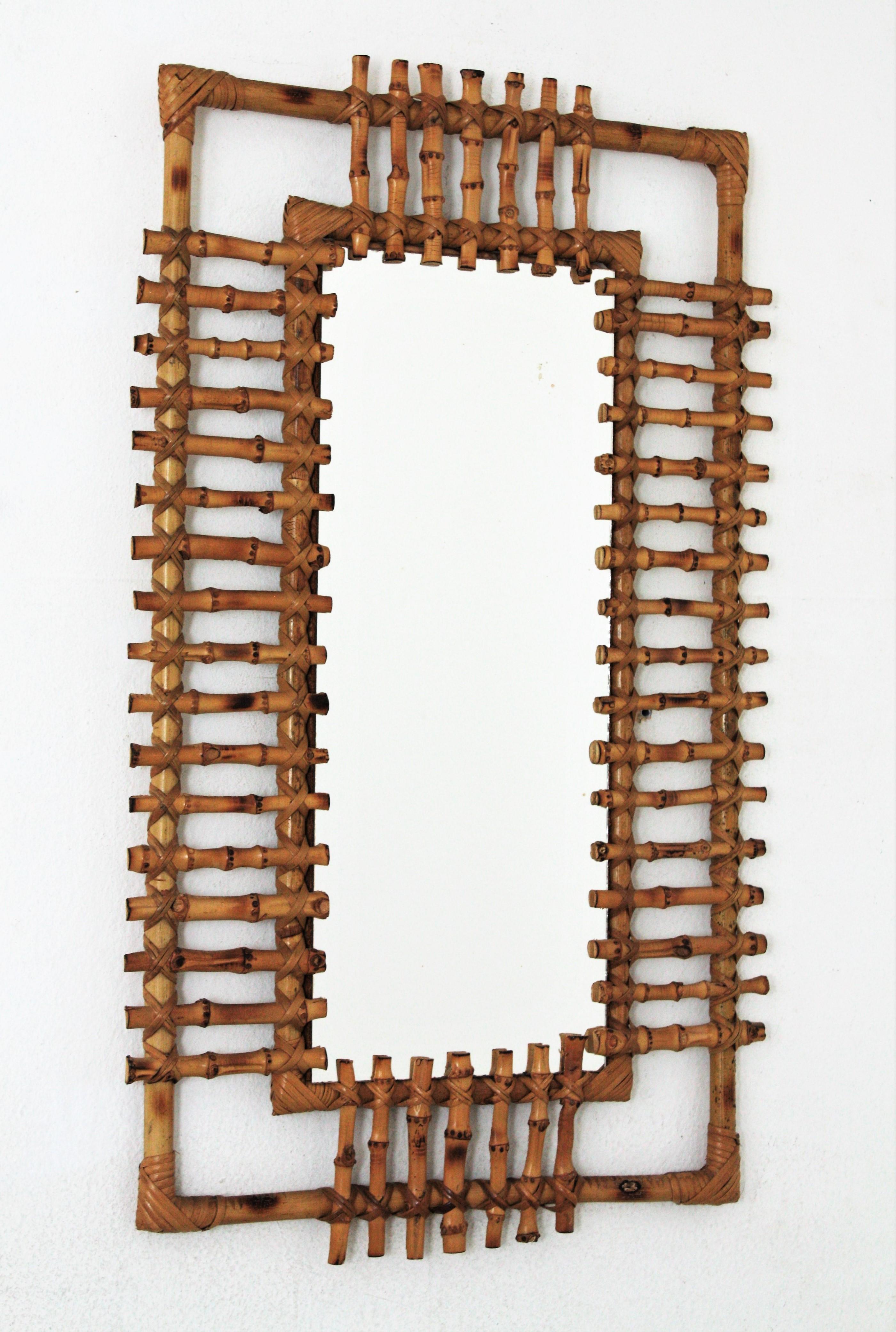 A beautiful handcrafted French Riviera rectangular shaped bamboo mirror, framed by cane rays. France, 1950-1960.
This piece has all the taste and freshness of the Mediterranean style.
Interesting to be used in a powder room. Place it alone or