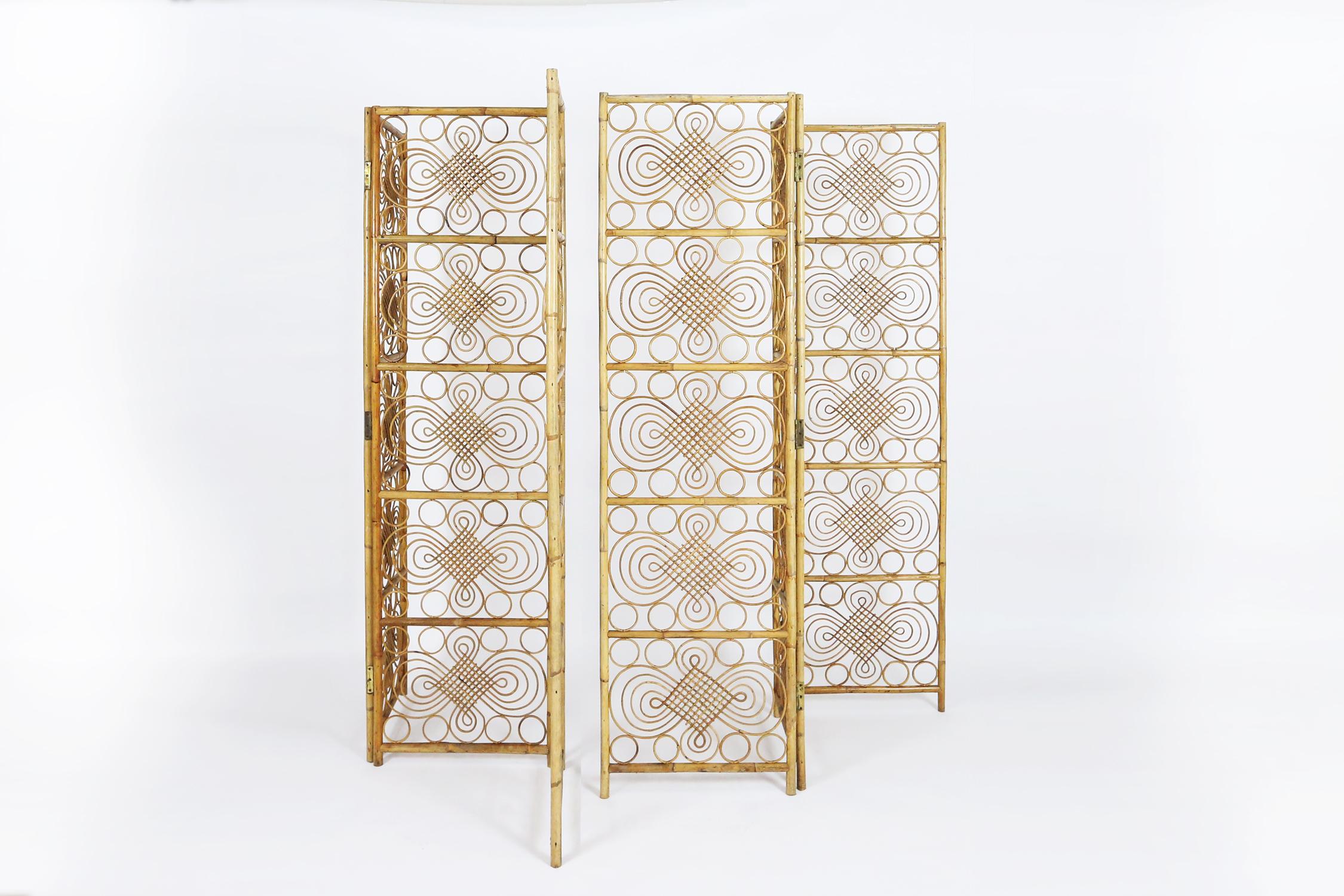 Highly decorative French room divider or folding screen in bamboo and rattan. We have 2 identical 3-panel room dividers available. Each room divider measures 153cm long, so both together makes a nice length of more than 3m
Both pieces are in very