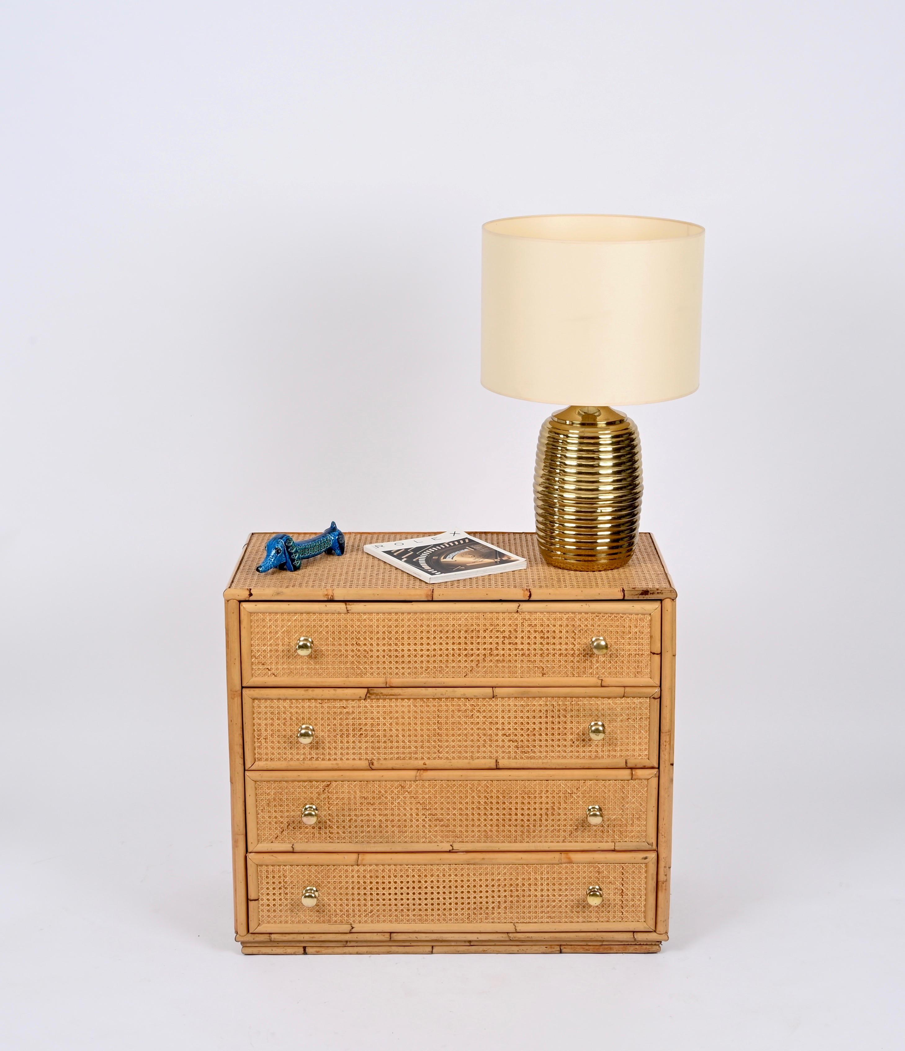 Spectacular Mid-Century chest of drawers fully made in rattan and Vienna straw with Brass knobs. This delightful French Riviera style chest of drawers was designed in Italy during the 1970s and is attributed to Dal Vera. 

This four-drawers commode