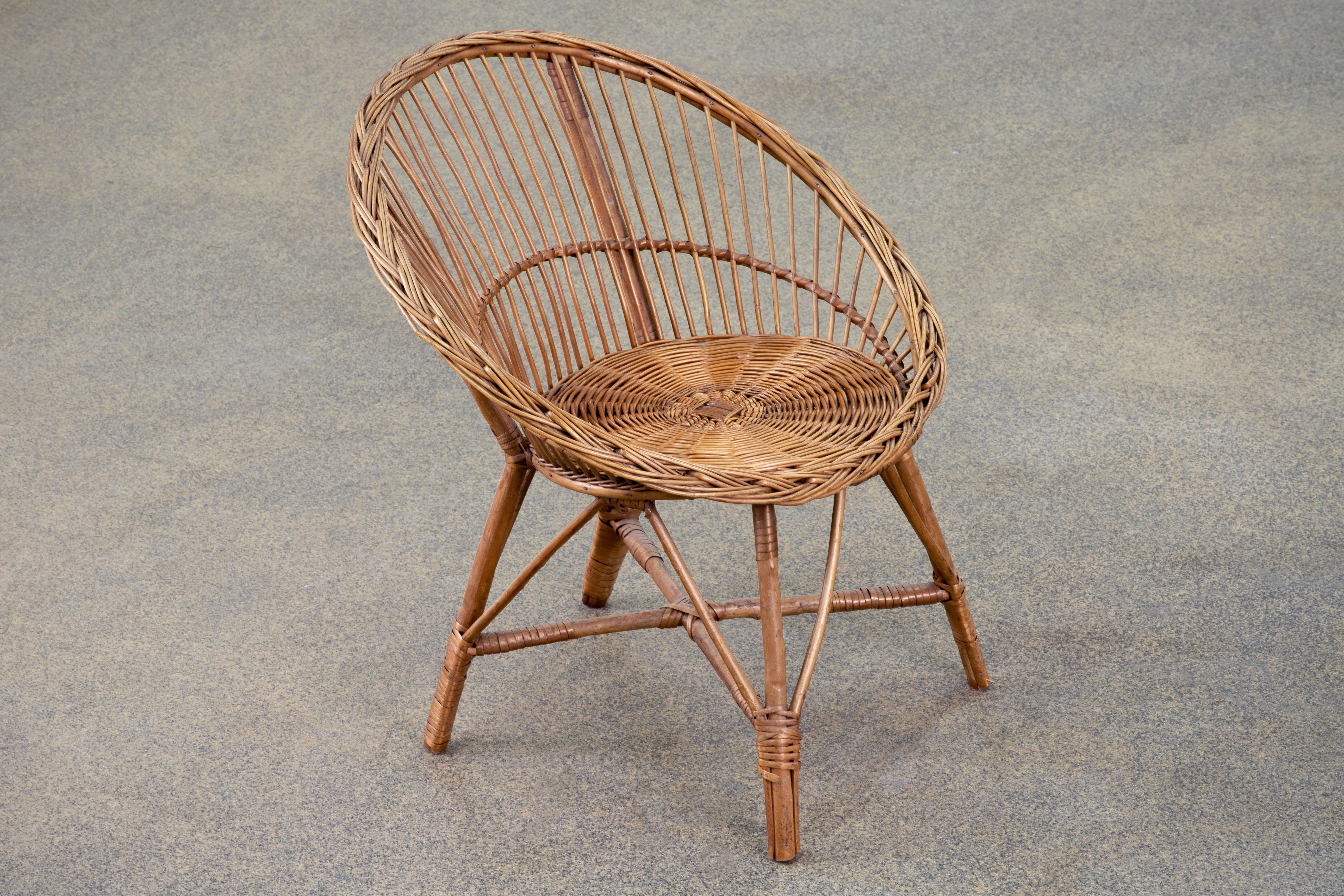 1960s oversized bamboo rattan lounge chairs Handmade in the French Riviera organic modern style. The chairs feature a large bent rattan frame fitted with Silky blue cushions. Very comfortable with excellent joinery and craftsmanship. Could also be