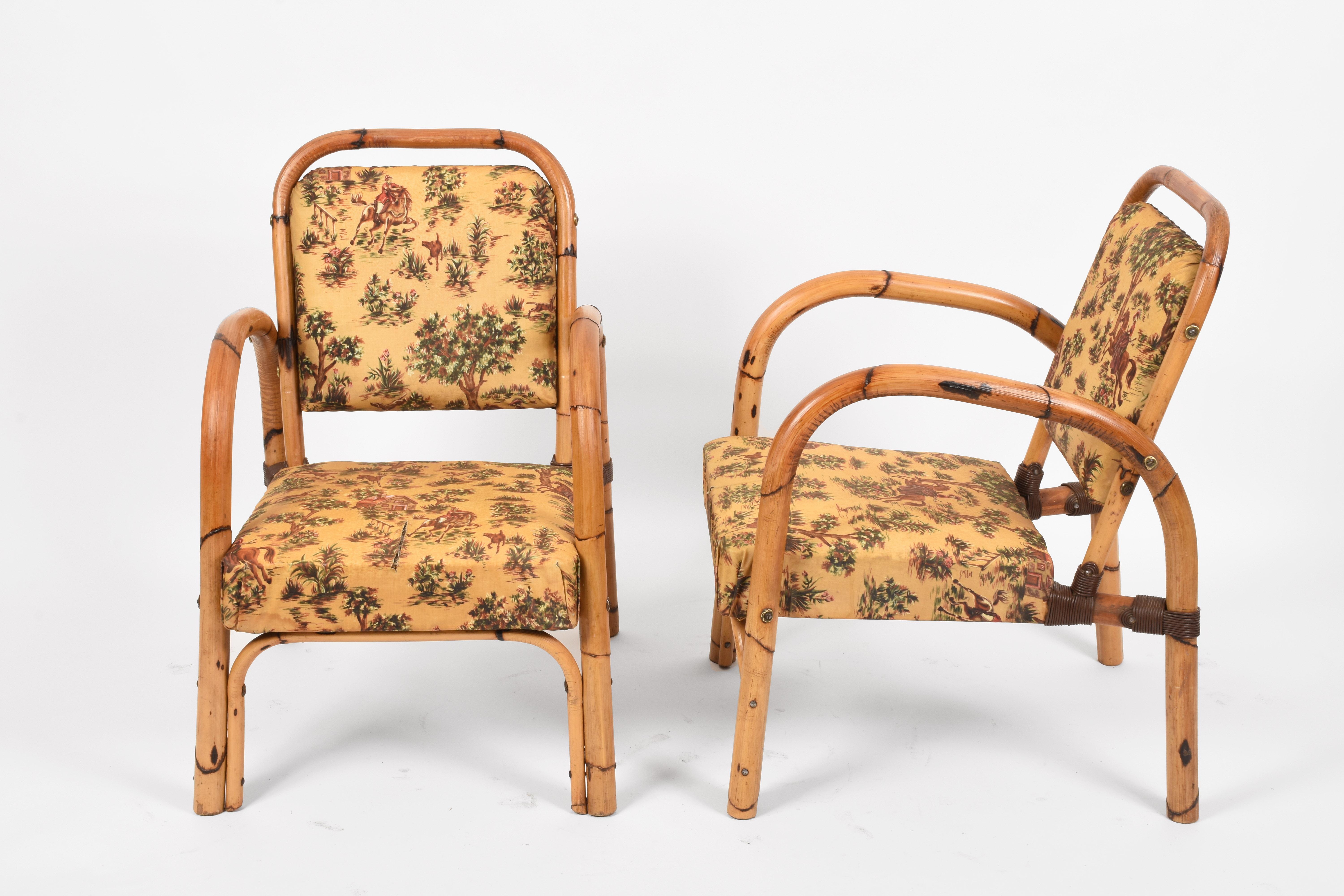 Stunning pair of Mid-Century armchairs in curved bamboo and knotted wicker, completed by their original floral upholstery. These delightful armchairs were produced in Italy during the 1950s by Dal Vera.

In overall amazing vintage conditions, the