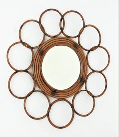 Espejo redondo de flores de ratán de la Riviera Francesa con marco de anillos, años 60