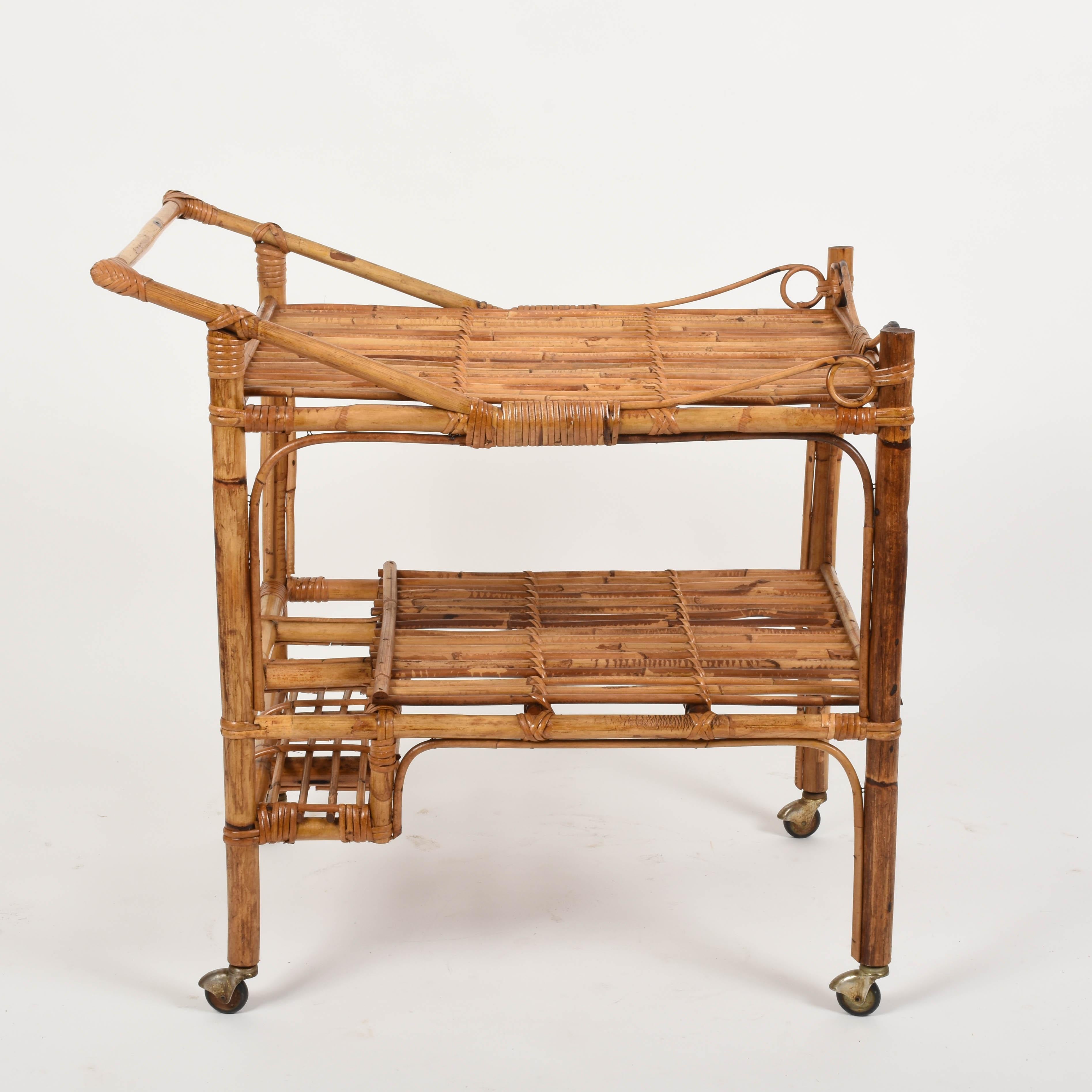 Fabulous French Riviera rectangular bamboo and rattan trolley bar cart. Bar cart from the 1960s. This amazing piece was designed and produced in France during 1960s.

This piece is unique as it has the main structure in bamboo and the surfaces in