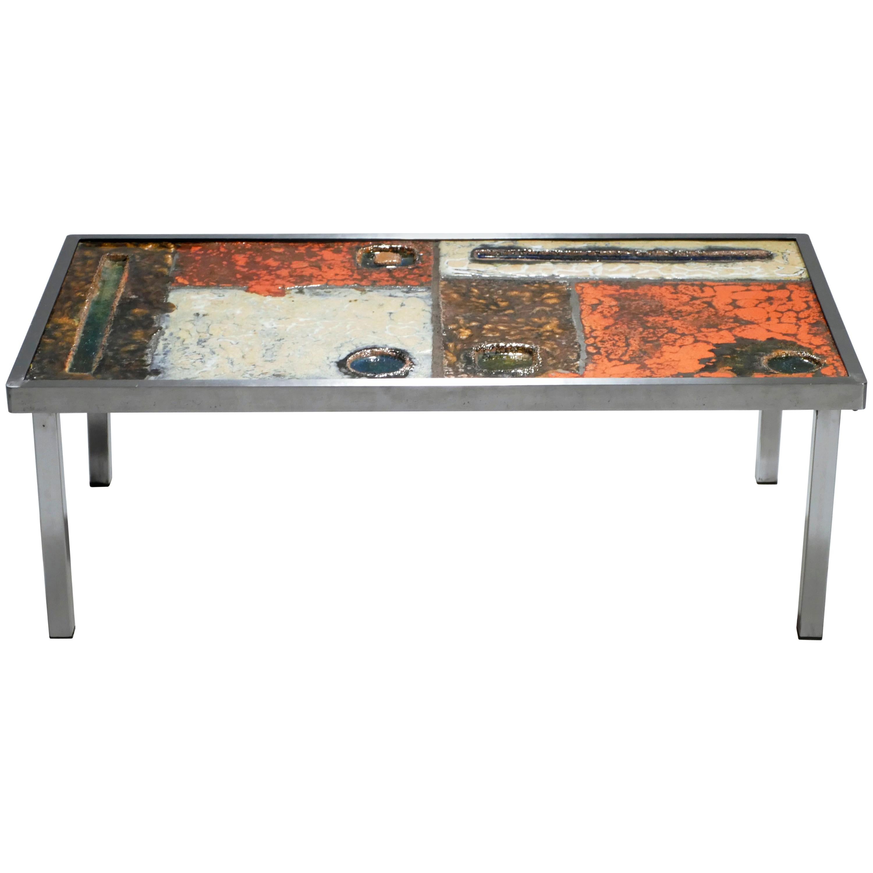 Robert and Jean Cloutier were ceramicists who viewed their work as art, with a functionality as perhaps a secondary purpose. This coffee table by the twin design duo can be converted into artwork to be hung on the wall, as the legs can be