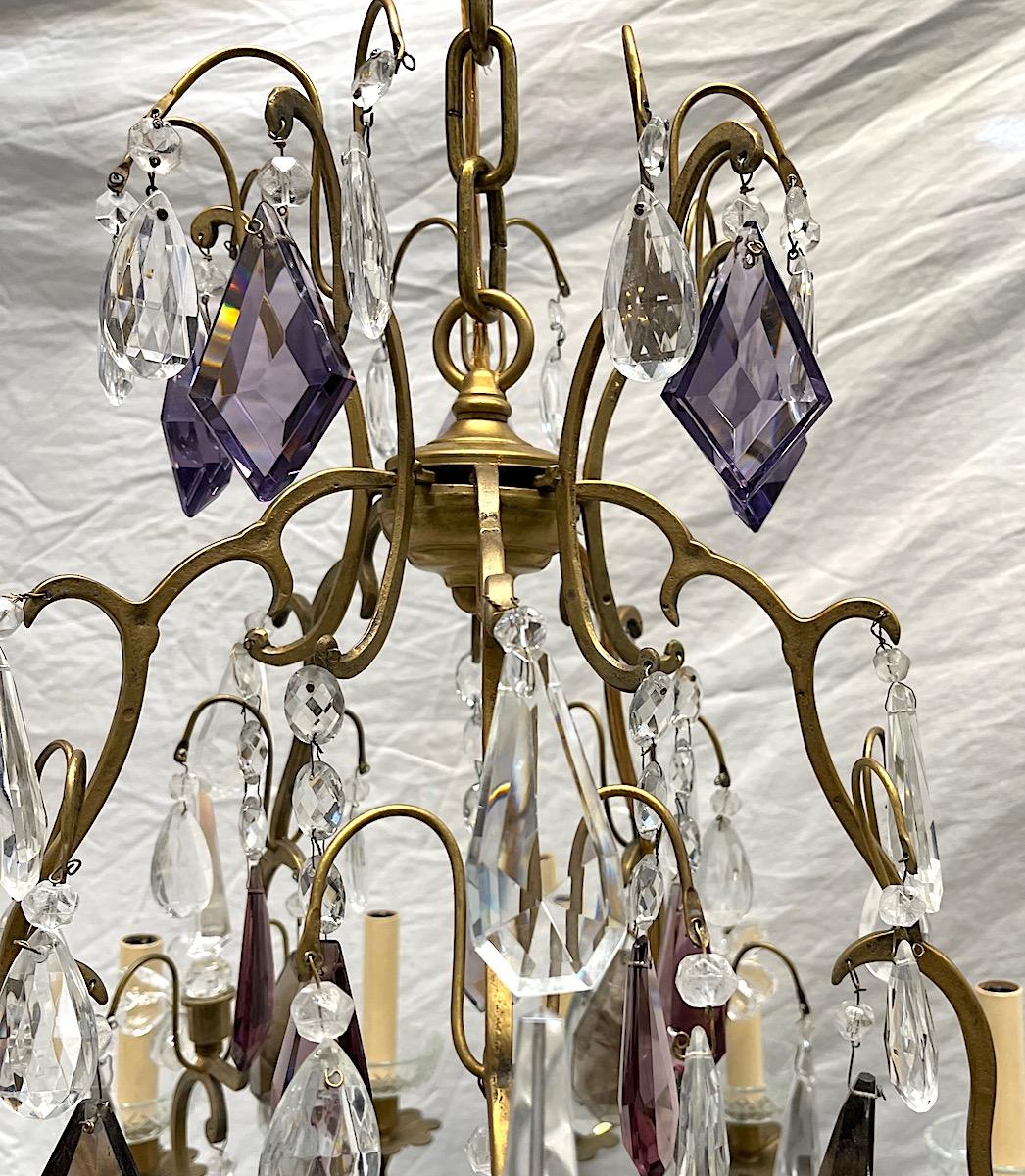 A circa 1920 French chandelier with gilt crystal pendants and with smoke color quartz, with 15 lights.

Measurements:
diameter: 30