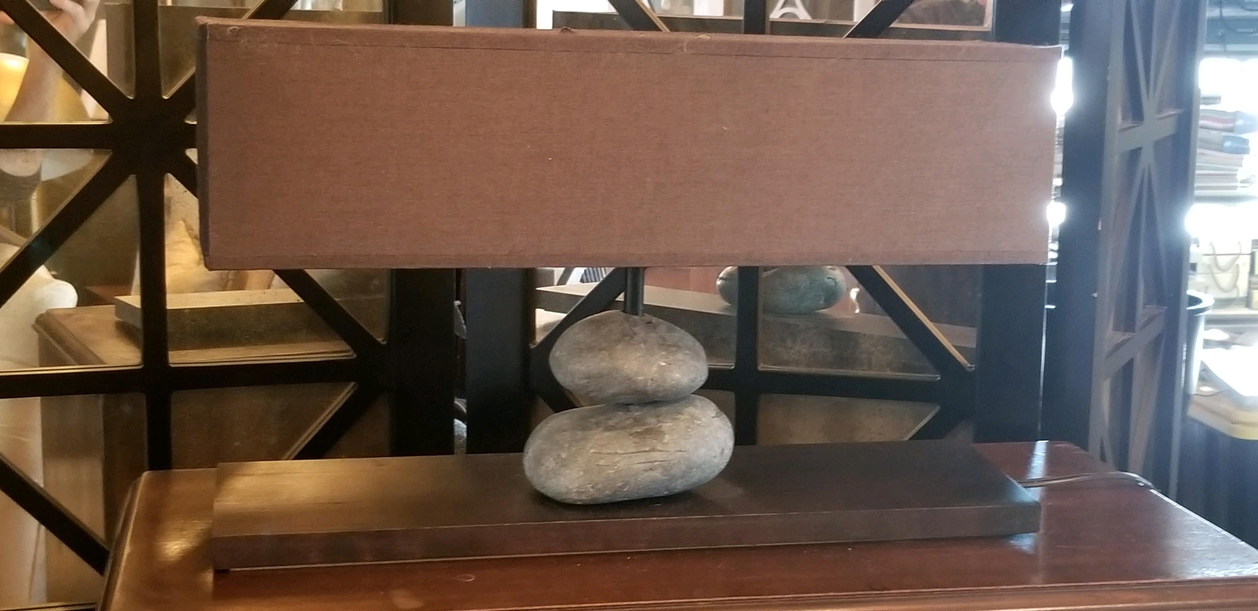Lovely French rock lamp from contemporary French Company. We sold a series of these and they remain popular for the unexpected element in any room. Hand cut shade and hand drilled stone elements.