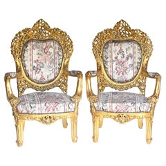 Französische Rokoko-Armlehnstühle Fauteuils aus geschnitztem Giltwood