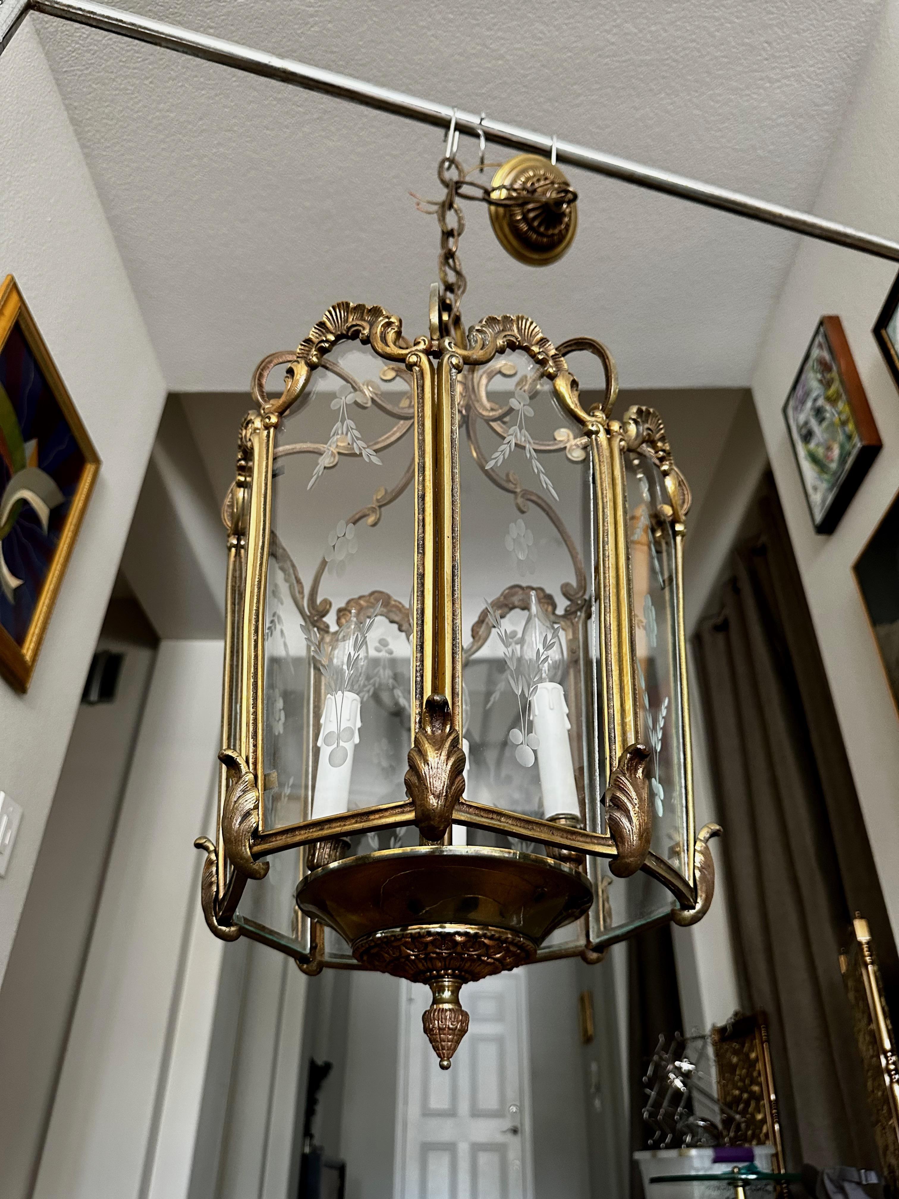 Large French 1940's rococo style brass and etched glass lantern hall light pendant.  Well constructed with nice overall detailing throughout. Uses 4 candelabra size bulbs. Height of fixture 26