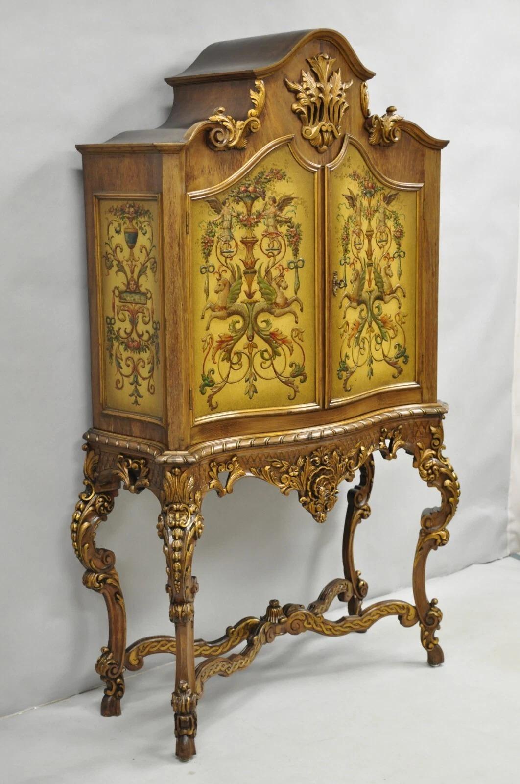 Antique French Rococo Carved Walnut Hand Painted Louis XV Style Blind China Cabinet Bar. Item features tall shapely carved cabriole legs with hand painted Neoclassical scenes to doors and sides. Circa Early 20th Century. Measurements: 72
