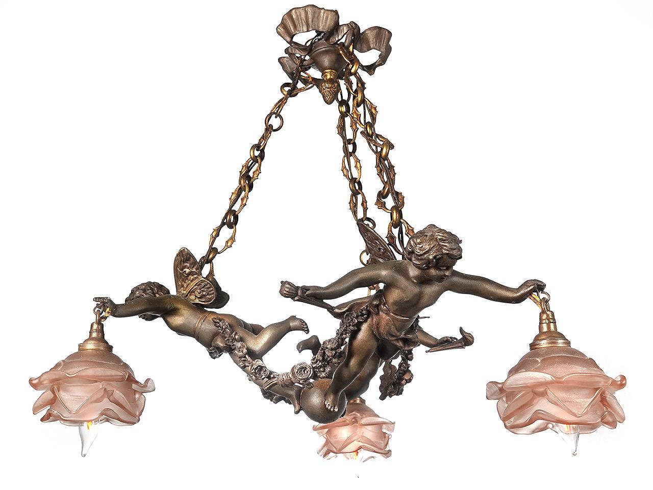 This is a beautiful high style French 3 light chandelier with hand blown Dresden flowers, circa 1880. The shades are a rose color glass with a frosted finish. Each socket has been replaced with to take a standard E12 bulb. Each of the 3 bronze arms