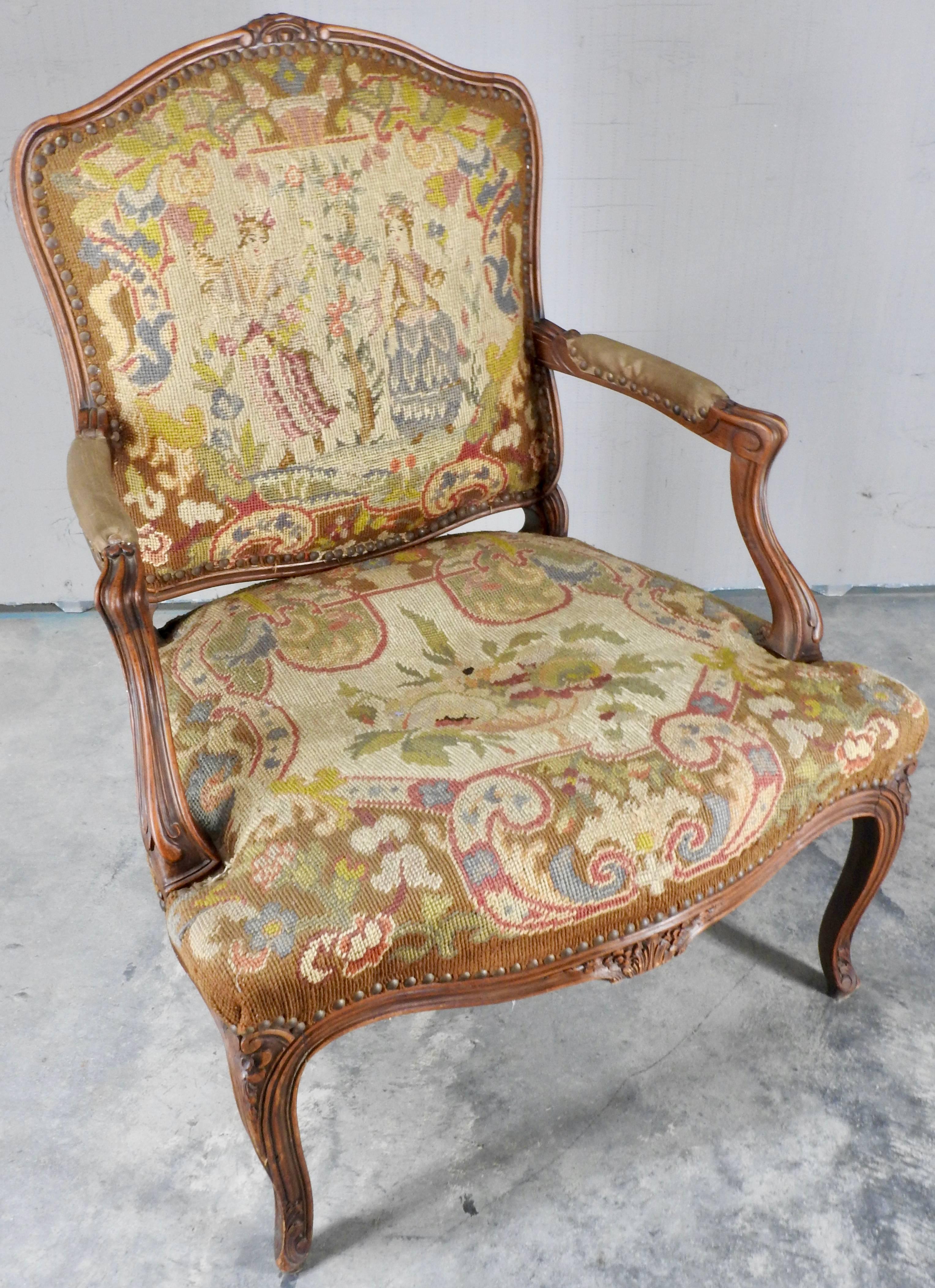 This beautiful Rococo chair has all the intricate hand-carving details. On either of the front legs there is a floral motif surrounded by scrollwork. In the center of the seat is another group of florals and scrollwork hand carved detail. Rising to