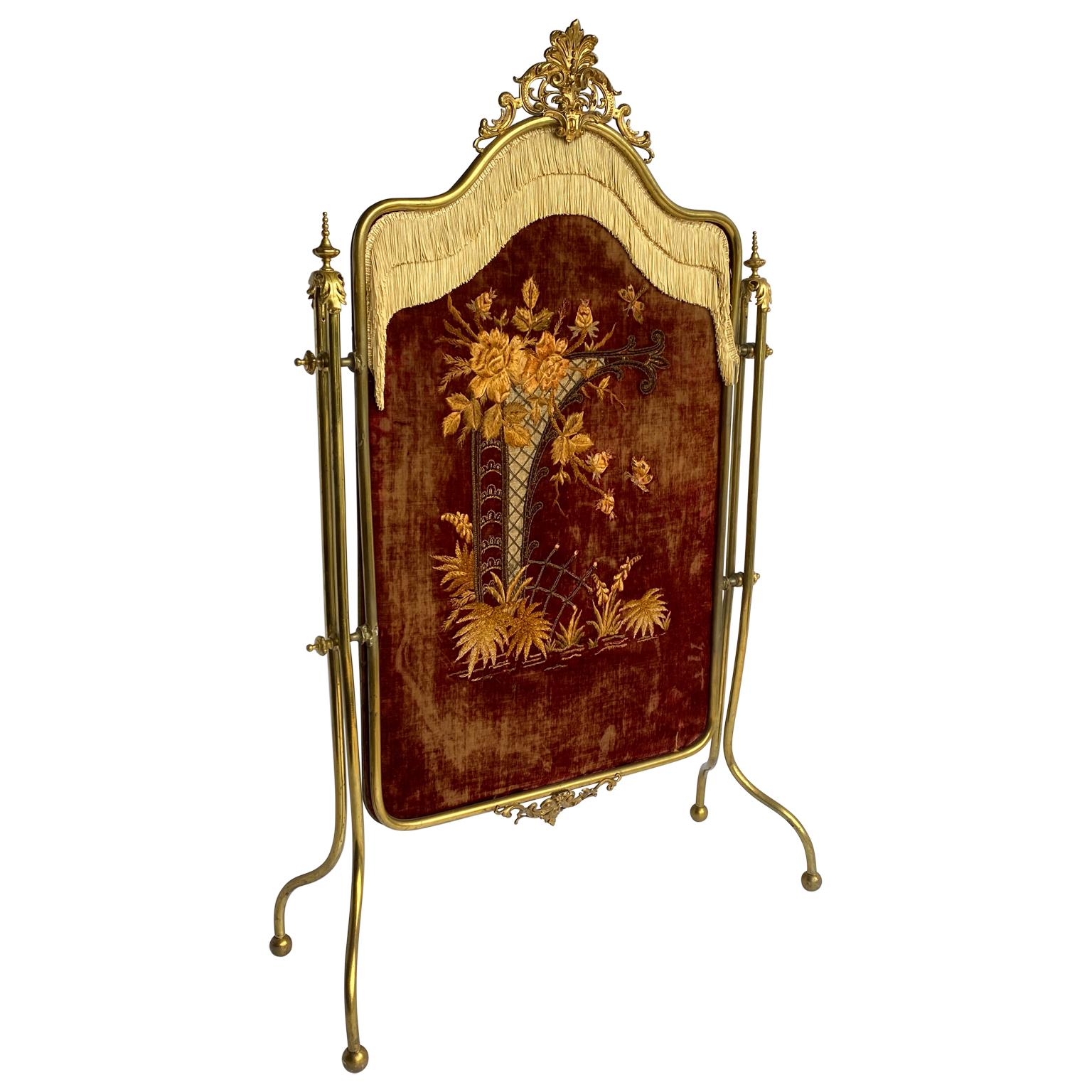 French Rococo Gilt and velvet fire screen. The Rococo period originating in France and was know for more delicate lovely textures, opulence; expense, feathery foliage; fantasy landscapes. Love of sensuous colors, fluid forms, lively movement. This