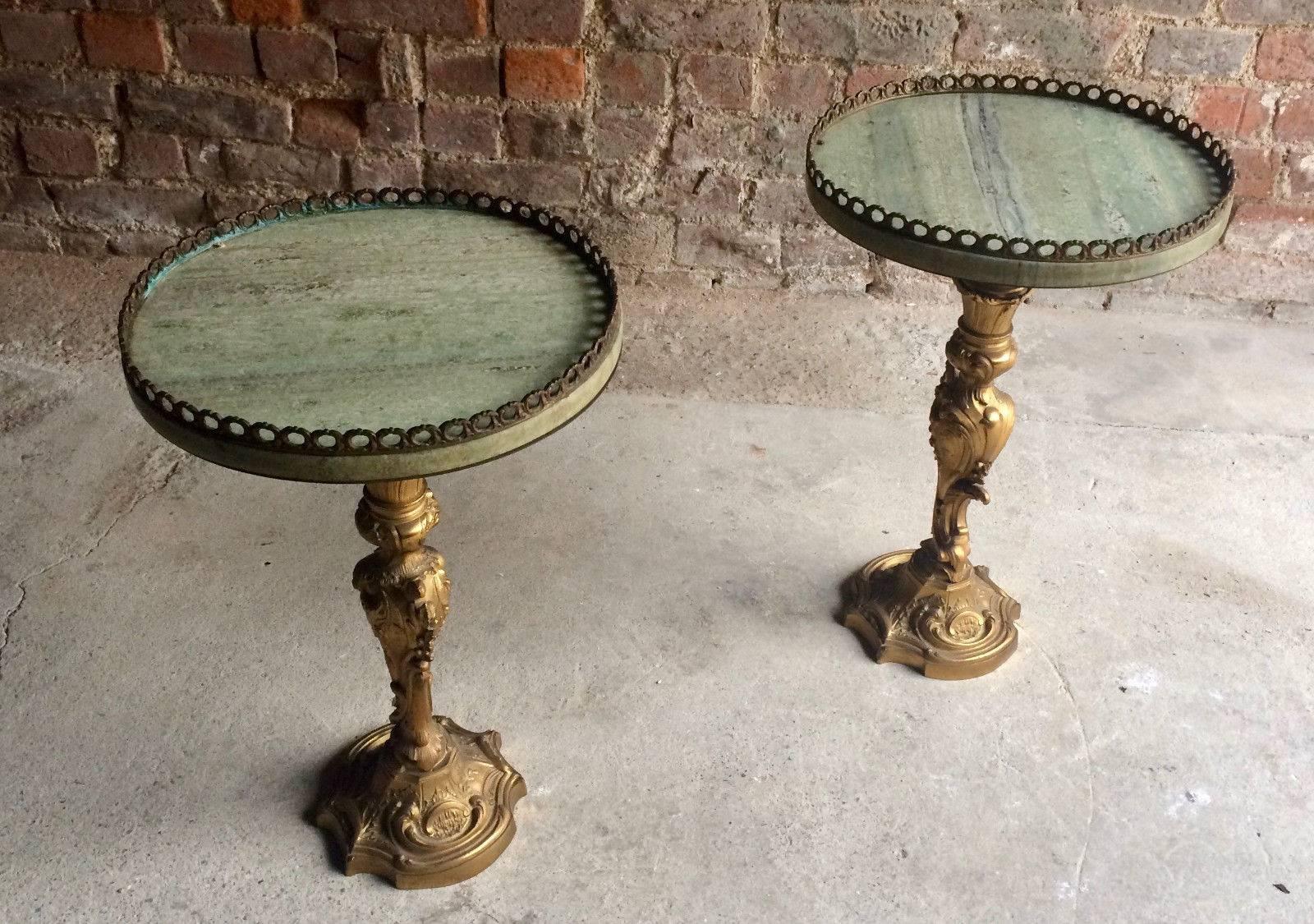 A magnificent and extremely beautiful pair of early 20th century French Rococo style brass light or side tables, beautiful scrolling base supporting circular brass banded green veined marble table tops.