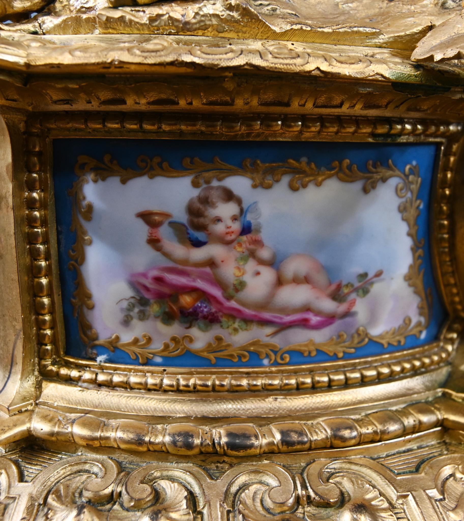 Late 19th Century French Rococo Mantel Clock Gilt Cherub Sevres Plaques 1890 For Sale
