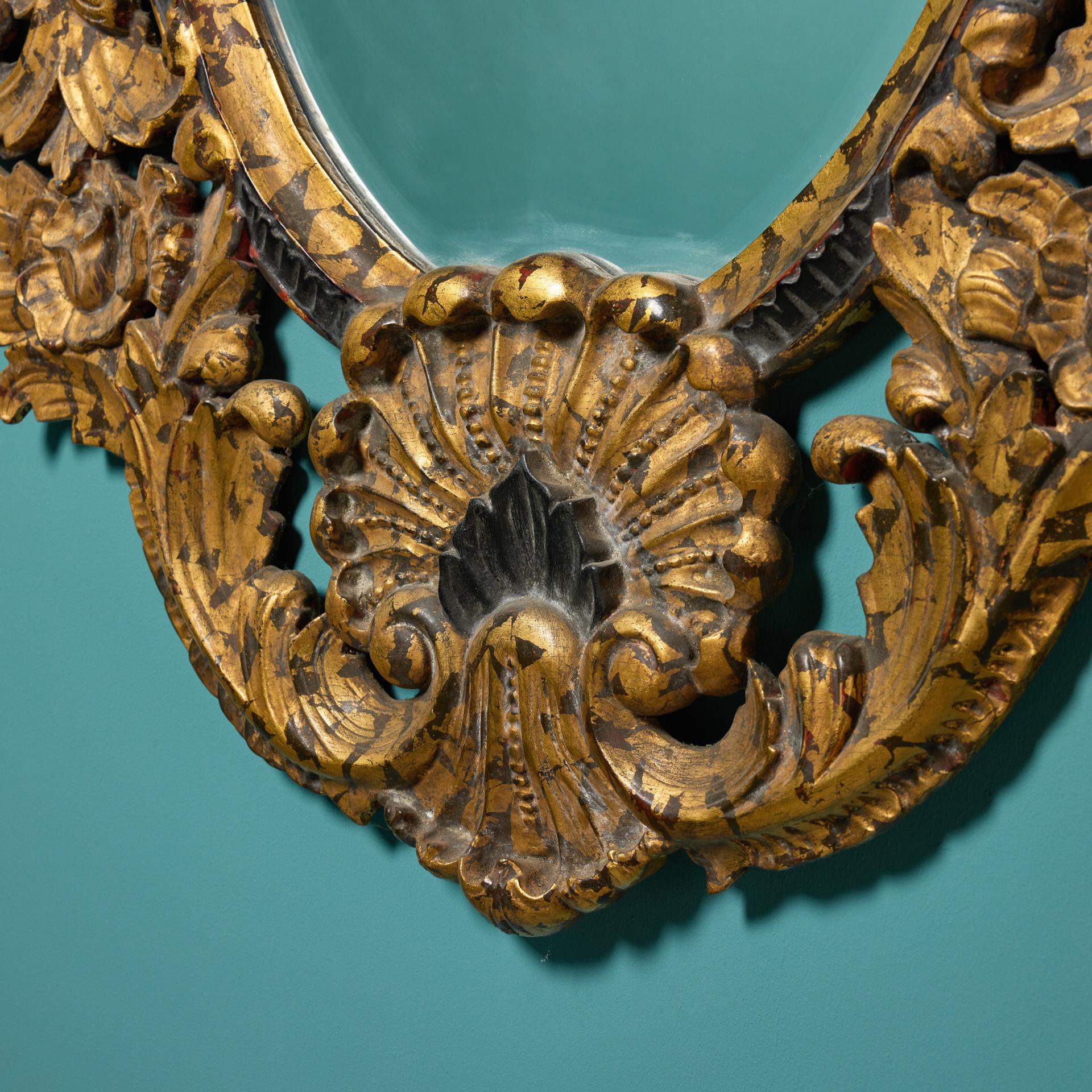 19th Century French Rococo Parcel Gilt Oval Wall Mirror For Sale