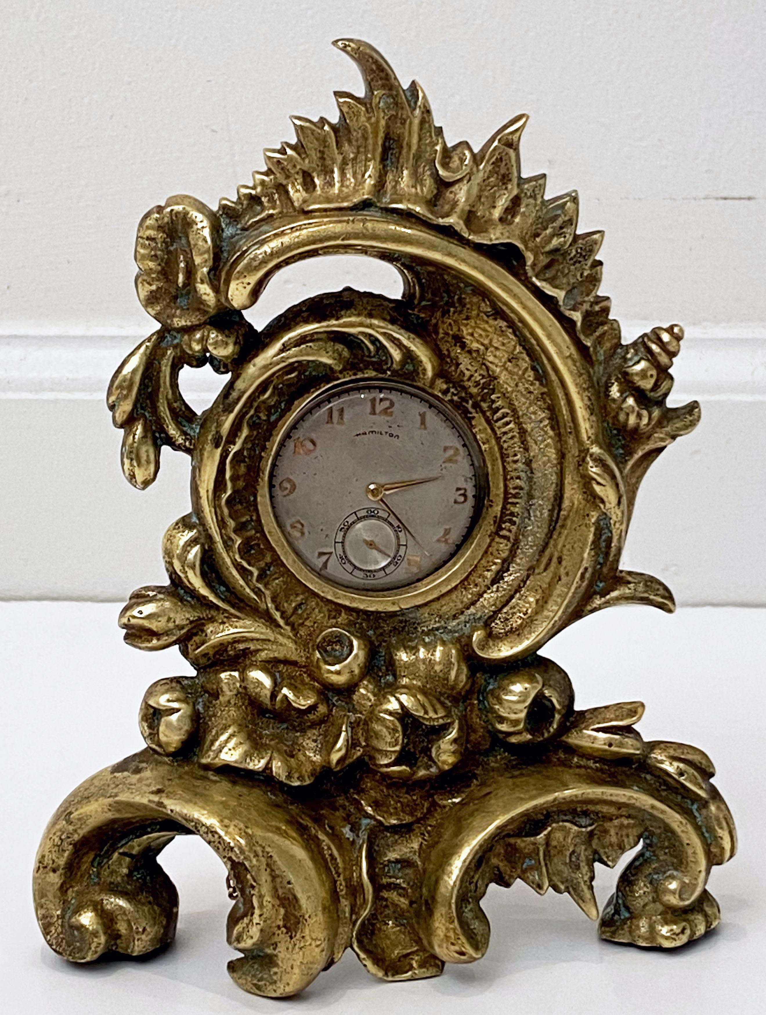 A fine French pocket watch holder or display stand of gilt bronze from the late 19th c. featuring a stylish rococo or baroque design.

Note: does not include pocket watch in photo.