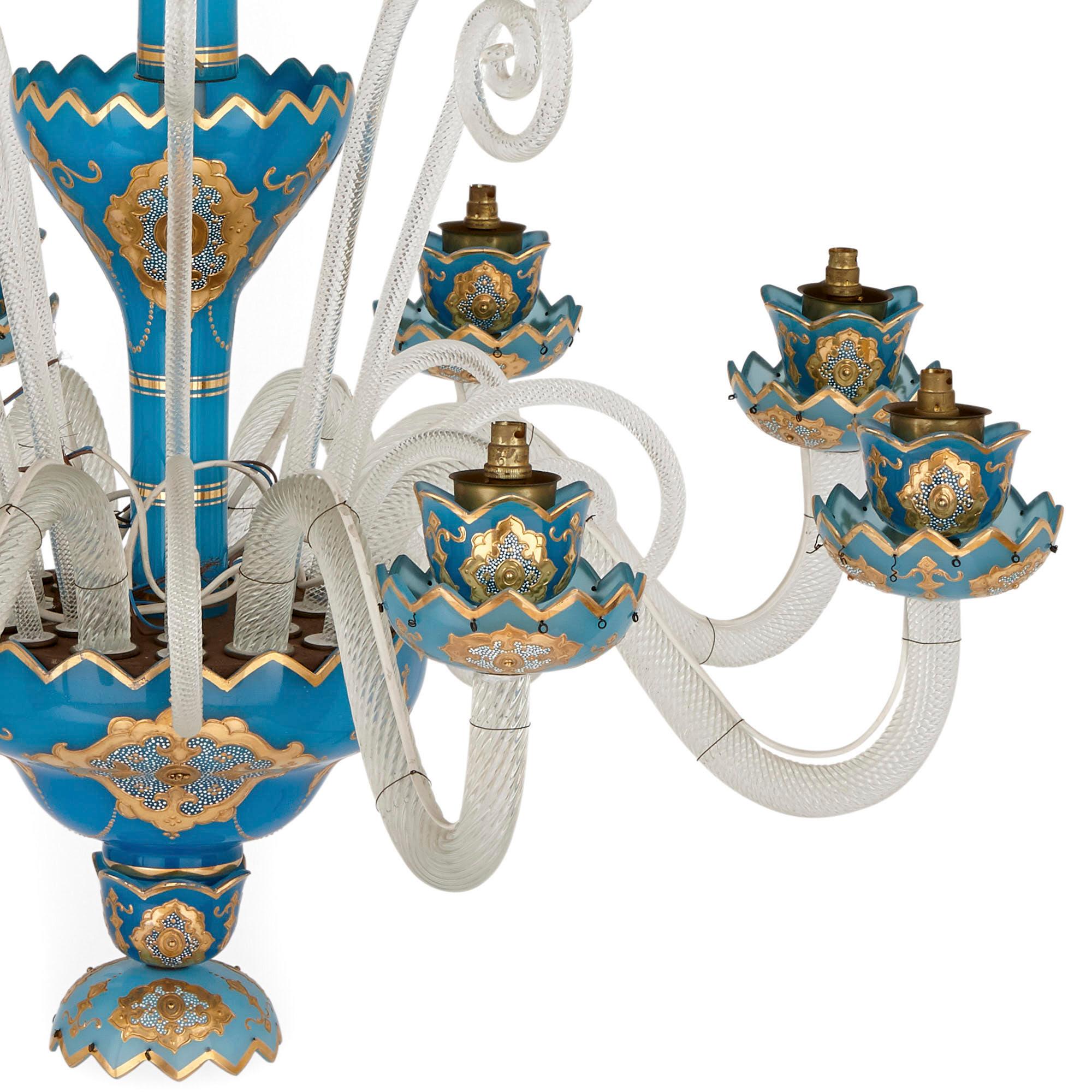 French Rococo Revival style gilt blue glass chandelier
French, early 20th century
Measures: Height 115cm, diameter 96cm

This superb chandelier is a wonderfully vibrant piece of early 20th century French design. The chandelier is designed