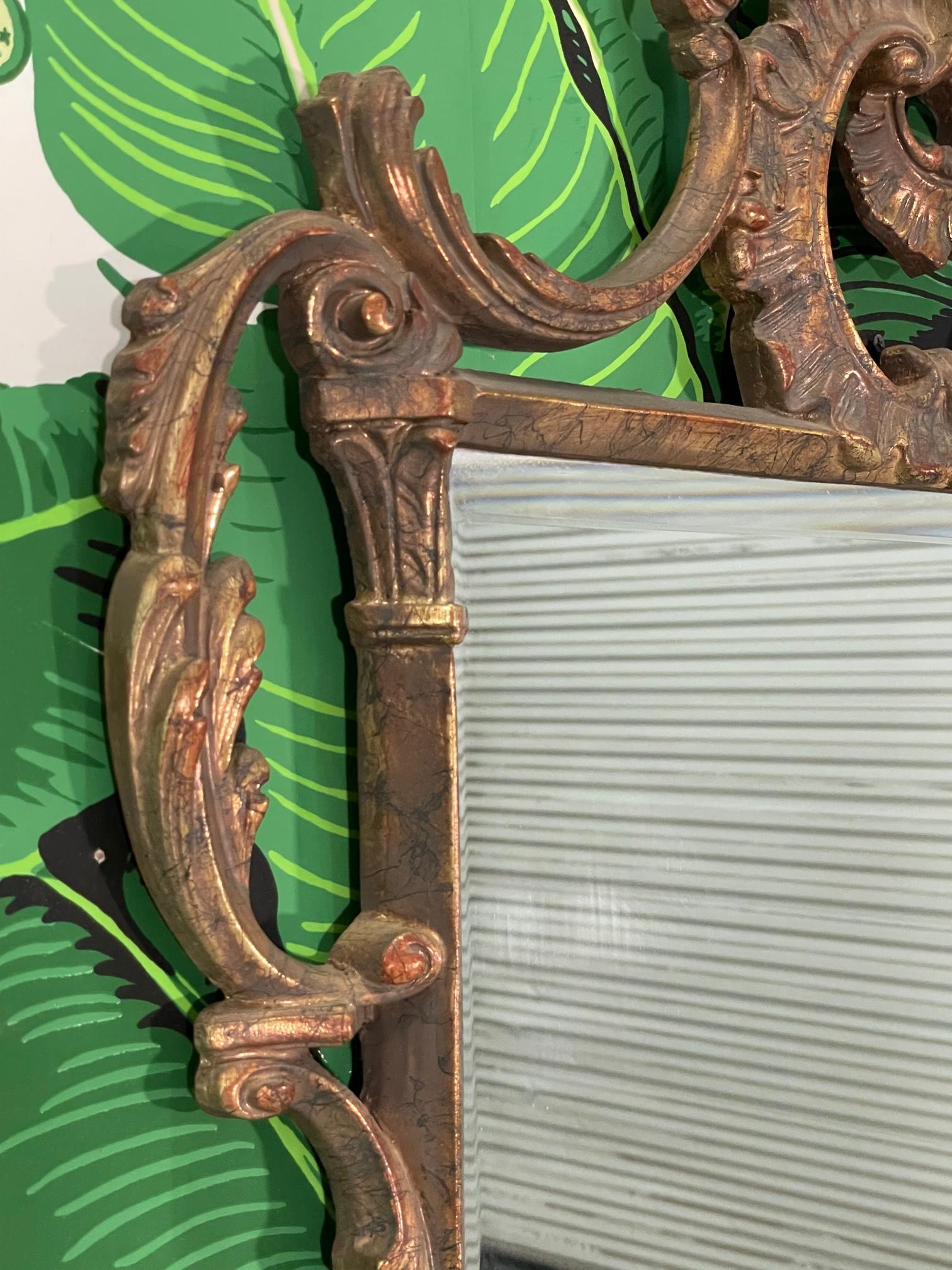 Rococo style wall mirror features ornate sculptural frame molded from composite resin. Good condition with imperfections consistent with age, see photos for condition details.
For a shipping quote to your exact zip code, please message us.
