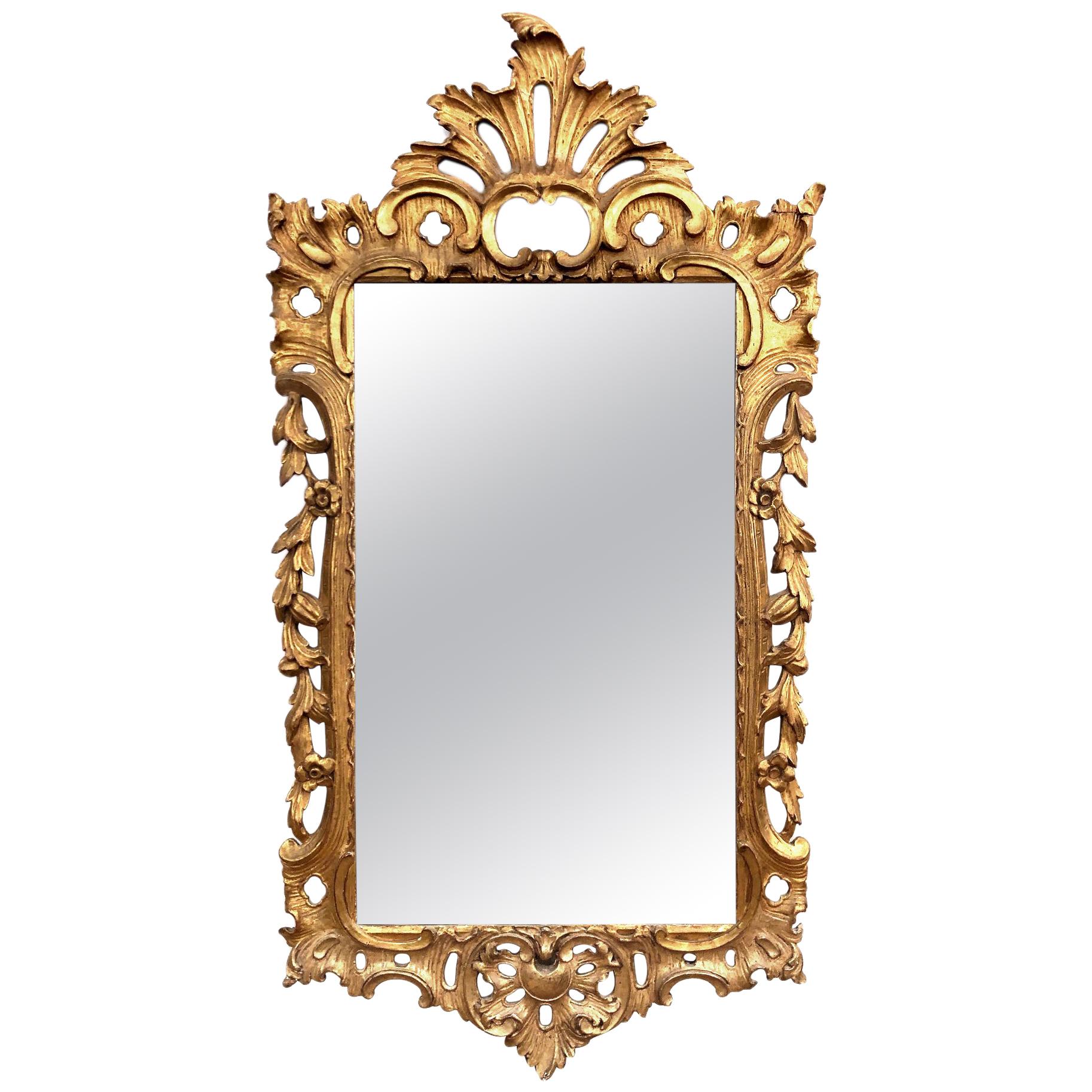Miroir en bois doré sculpté de style rococo français