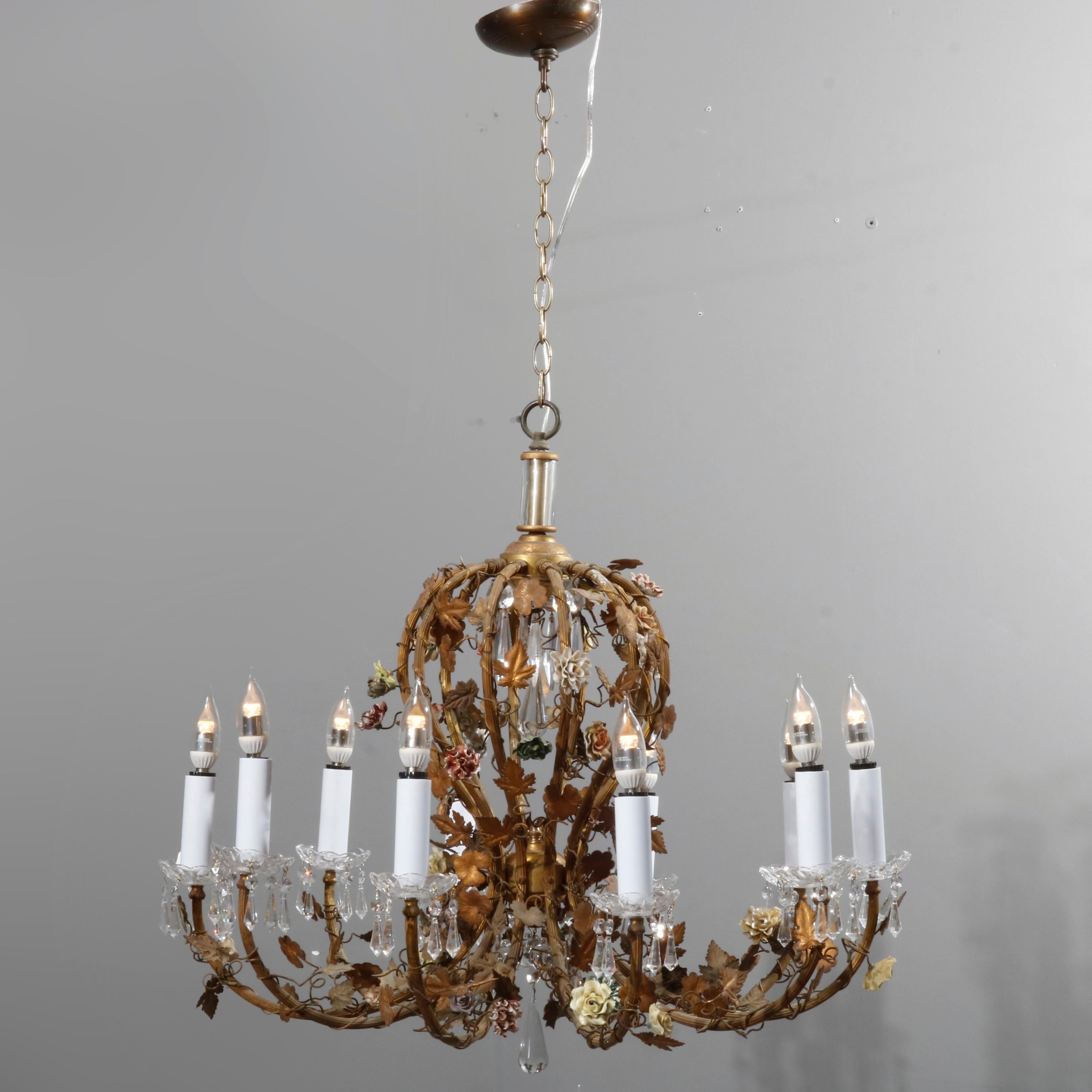An antique French Rococo style chandelier offers gilt metal foliate form frame with porcelain flowers and scroll and ten scroll arms terminating in candle lights, professionally wired for US electricity, circa 1930

Measures: 43.5
