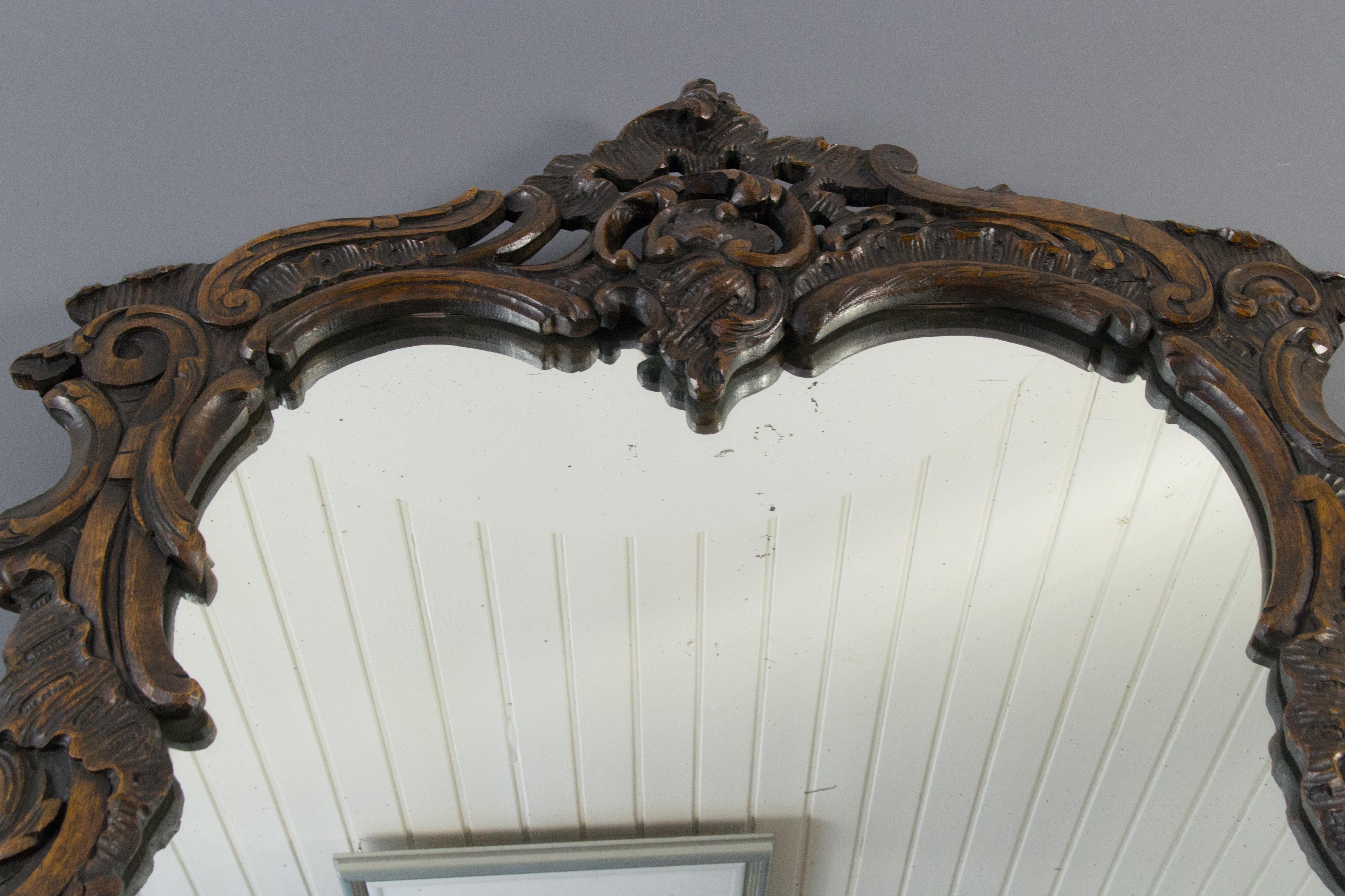French Rococo Style Ornate Carved Wood Dark Brown Wall Mirror Early 20th Century In Good Condition For Sale In Barntrup, DE
