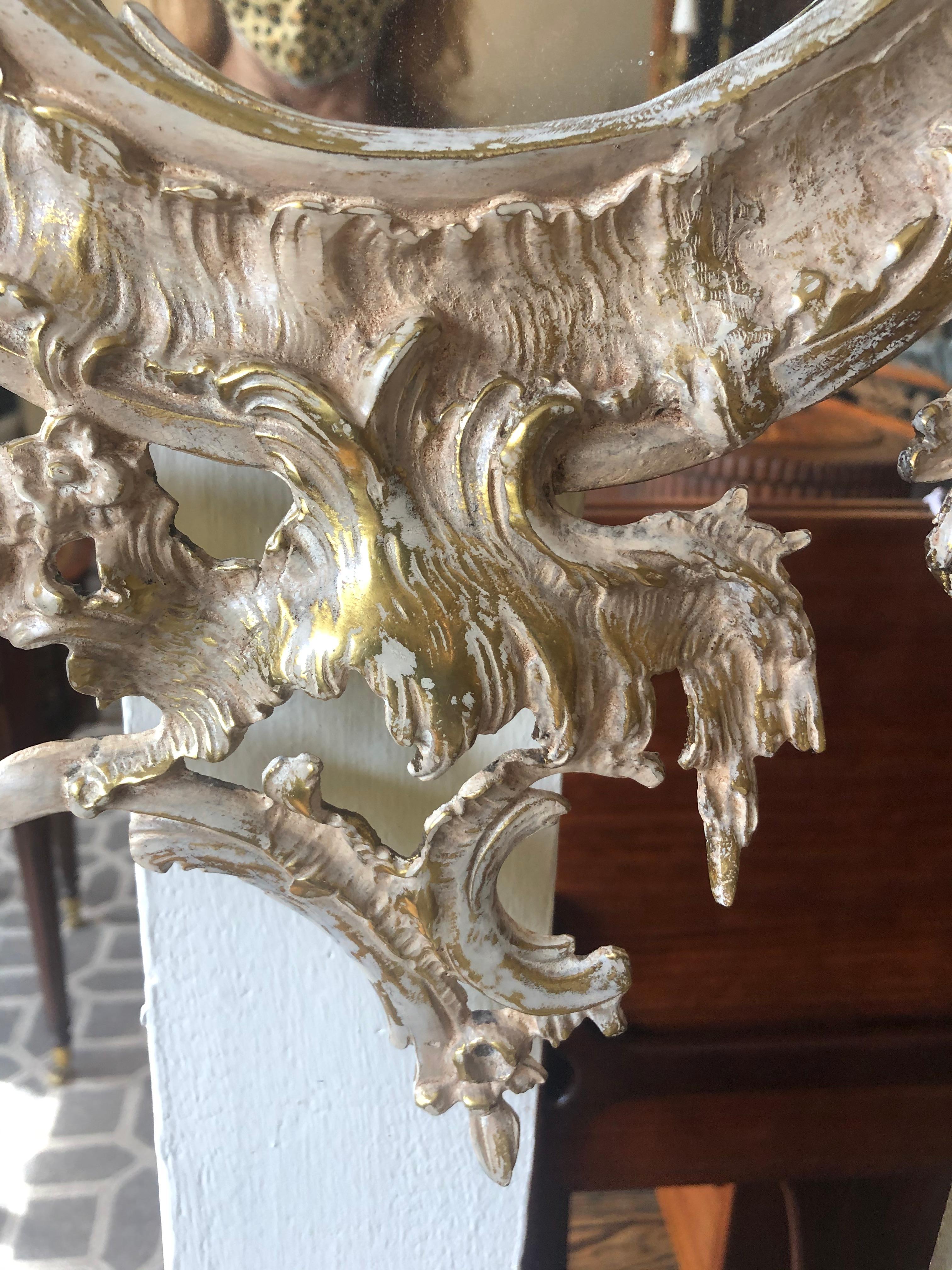 Late 20th Century French Rococo Style Relief Cast Brass and Antiqued Cartouche Shaped Wall Mirror