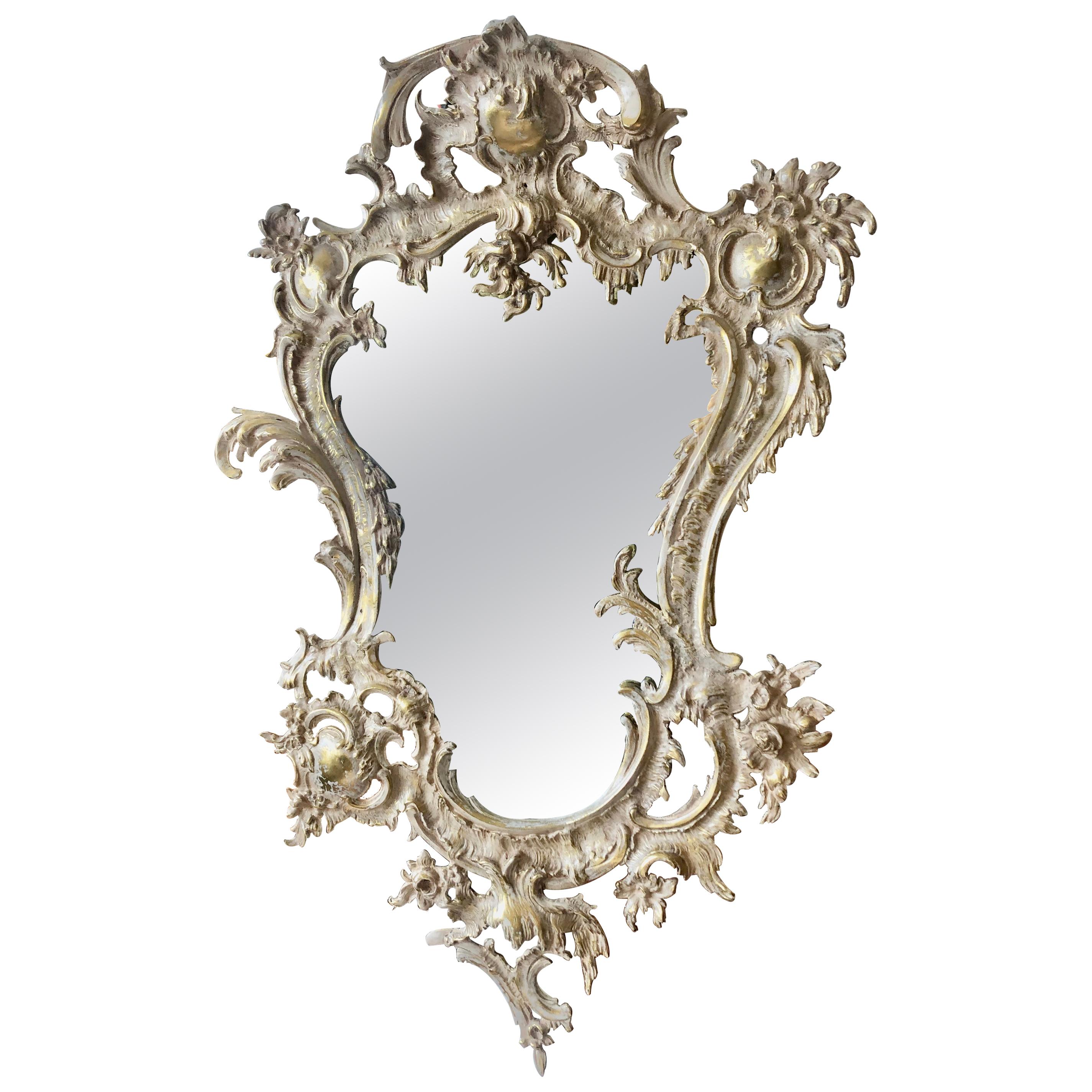 French Rococo Style Relief Cast Brass and Antiqued Cartouche Shaped Wall Mirror