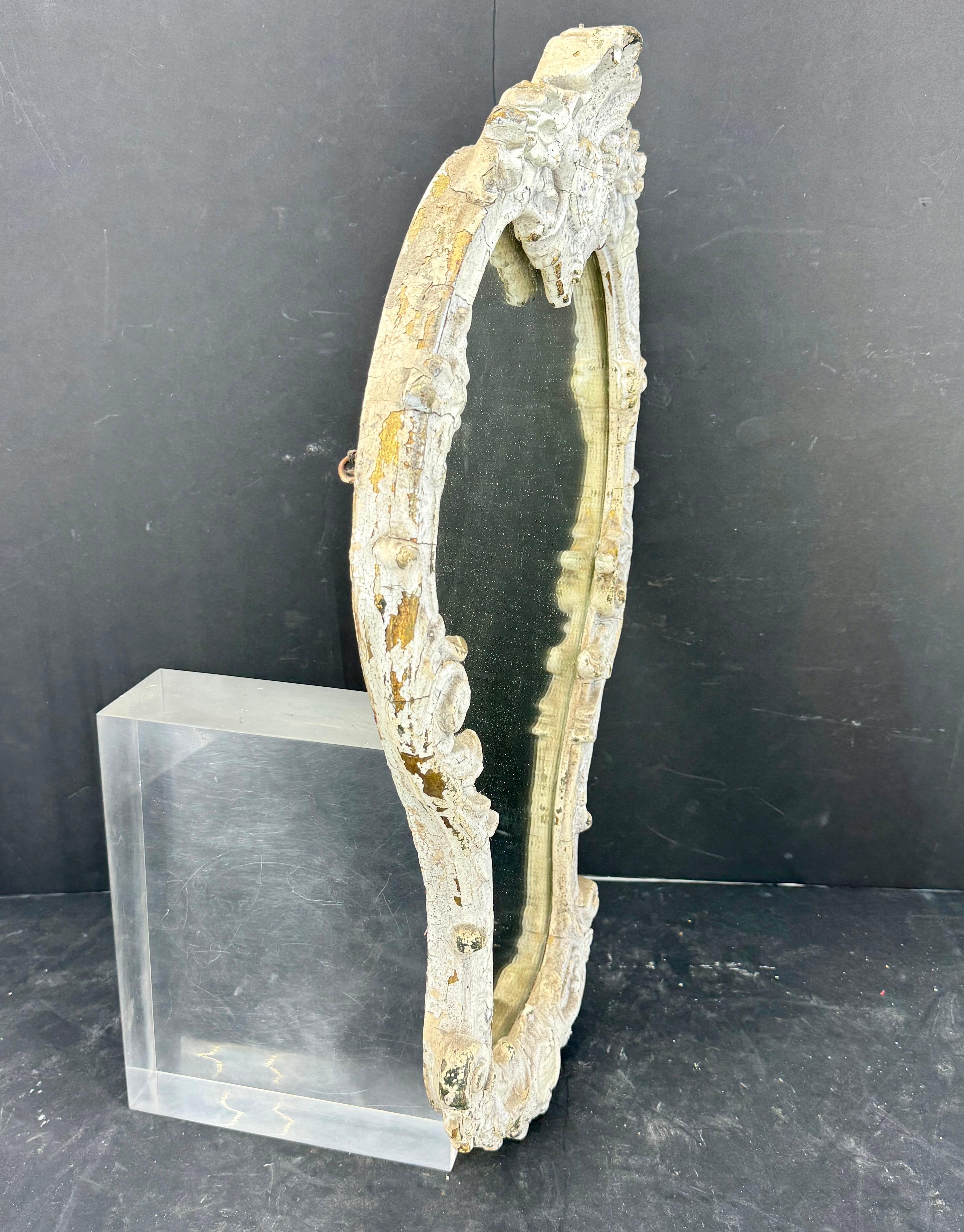 Charming vintage white painted mirror from France. This mirror certainly suitable as a stand alone piece or featured as part of a gallery wall in a living, dining or bedroom setting. This mirror could also be used as a powder room  in any formal or